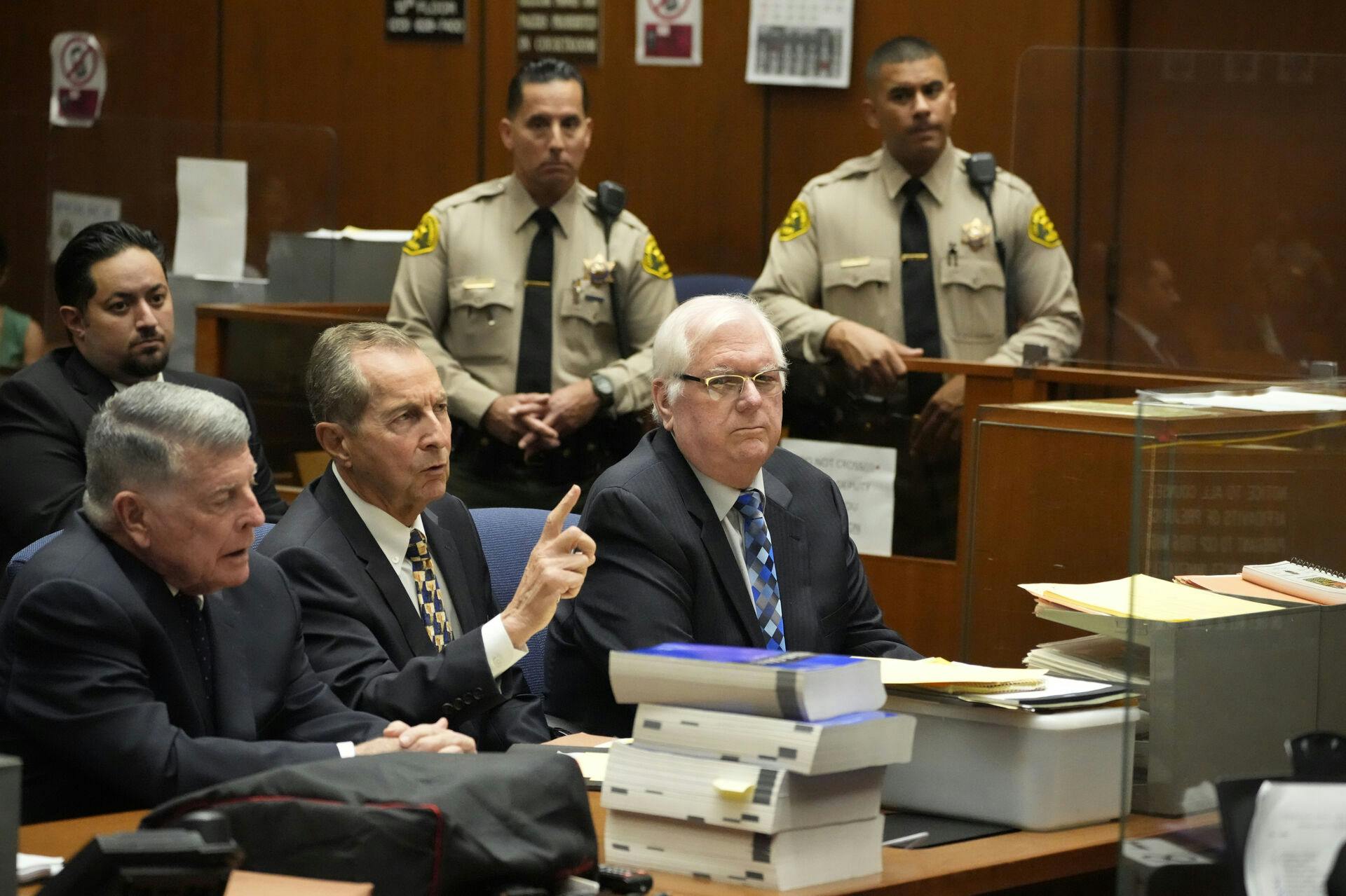 Orange County Superior Court Judge Jeffrey Ferguson, right, sits next to his attorneys John Drummond Barnett, left, and Paul Meyer during a hearing at the Clara Shortridge Foltz Criminal Justice Center, Tuesday, Aug. 15, 2023, in Los Angeles. The Southern California judge, Ferguson, charged with killing his wife during an argument while he was drunk, pleaded not guilty Tuesday, and his lawyer says it was an 'accidental shooting.' (AP Photo/Damian Dovarganes)