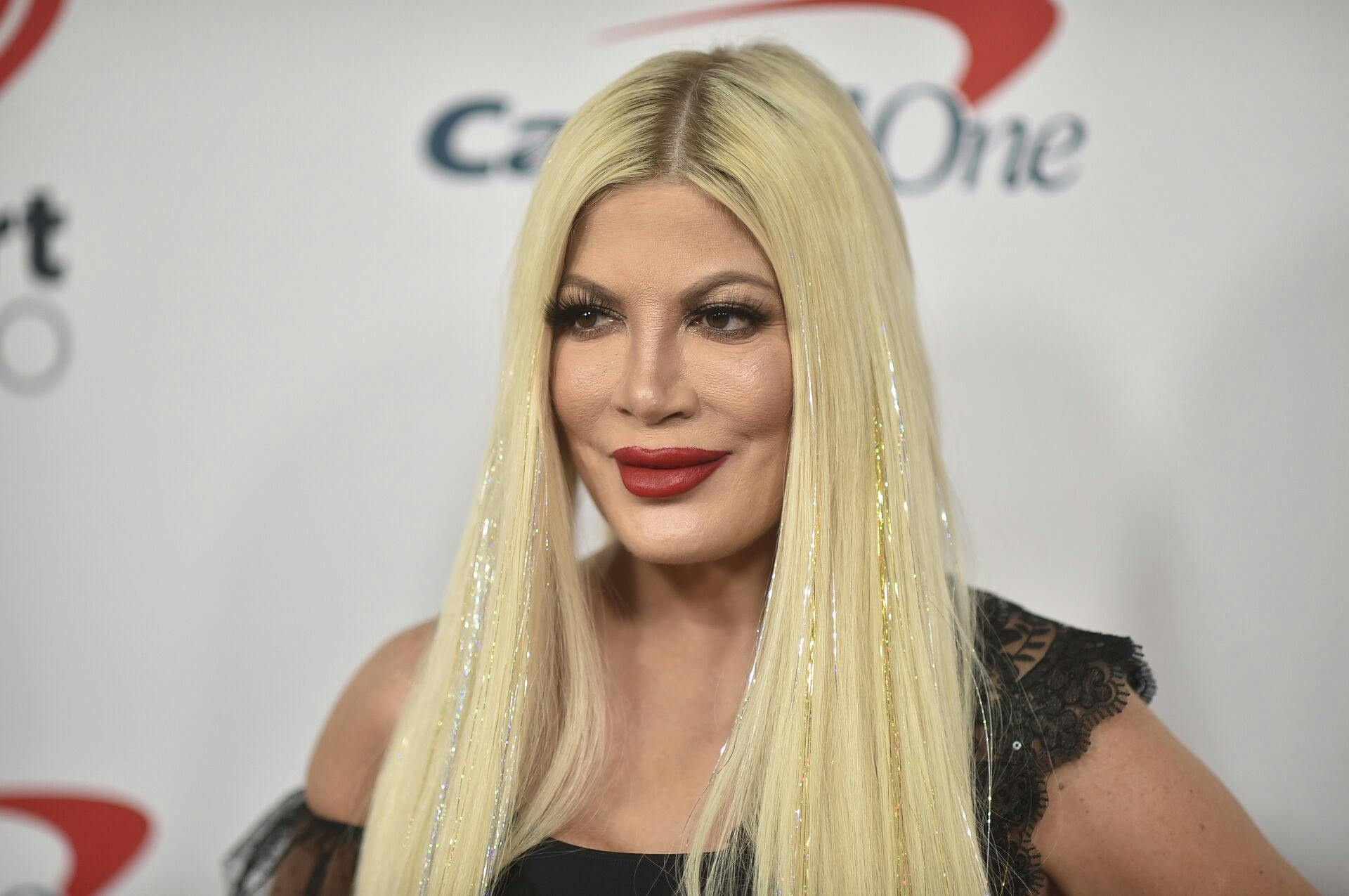 Tori Spelling arrives at the 2021 Jingle Ball Los Angeles at the Forum on Friday, Dec. 3, 2021, in Inglewood, Calif. (Photo by Richard Shotwell/Invision/AP)