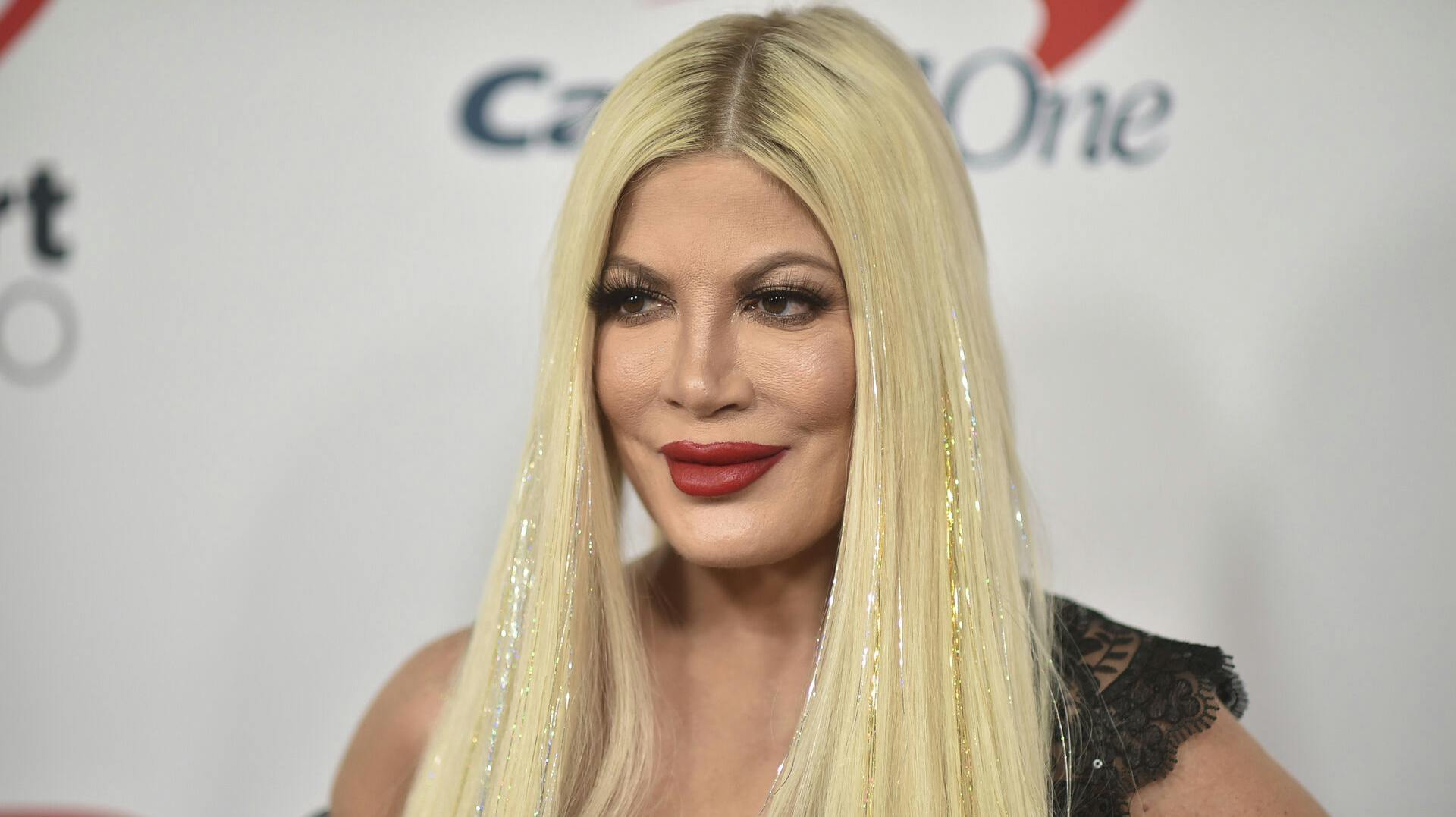 Tori Spelling arrives at the 2021 Jingle Ball Los Angeles at the Forum on Friday, Dec. 3, 2021, in Inglewood, Calif. (Photo by Richard Shotwell/Invision/AP)