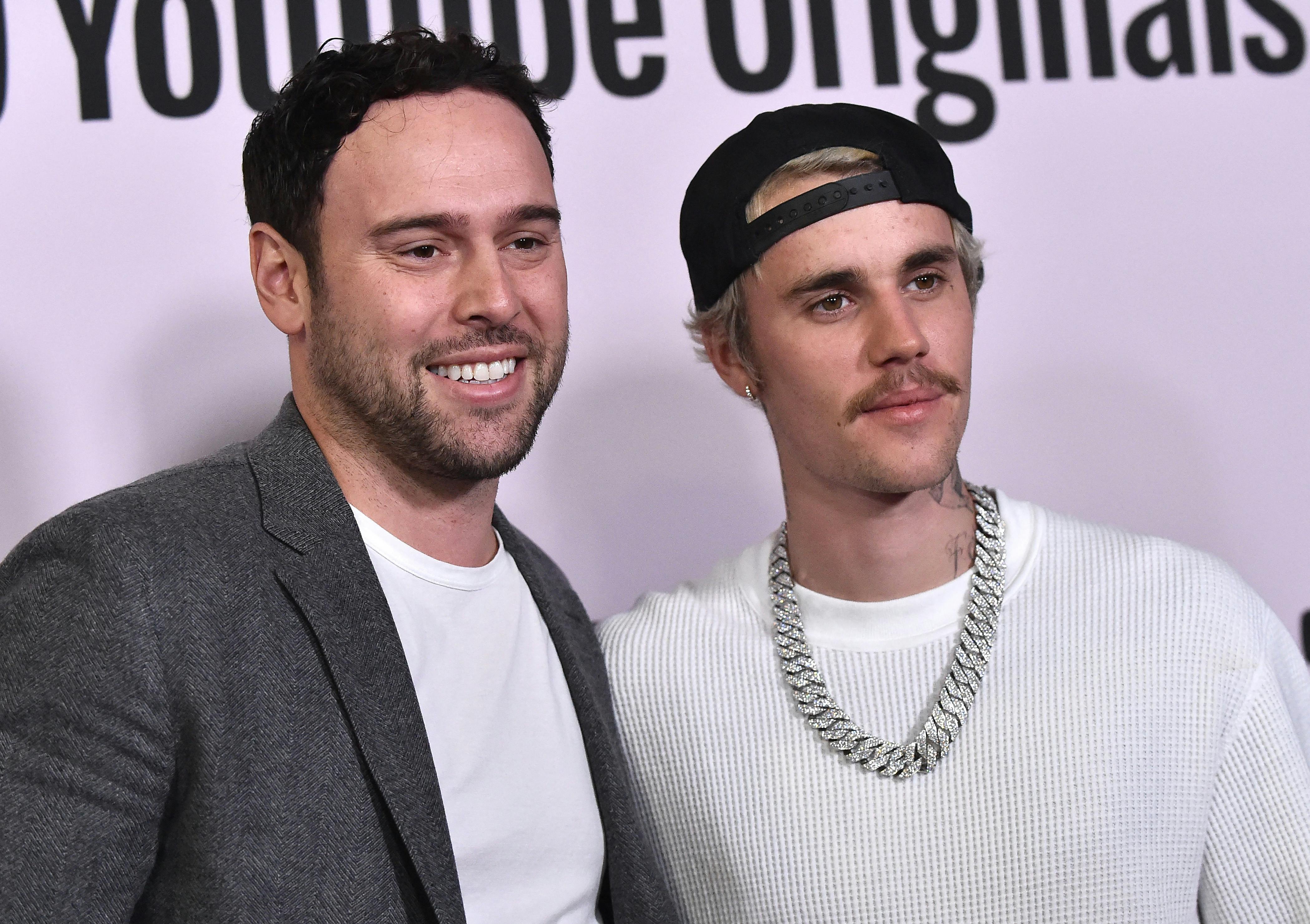 US businessman Scooter Braun (L) and Canadian singer Justin Bieber arrive for YouTube Originals' "Justin Bieber: Seasons" premiere at the Regency Bruin Theatre in Los Angeles on January 27, 2020. LISA O'CONNOR / AFP