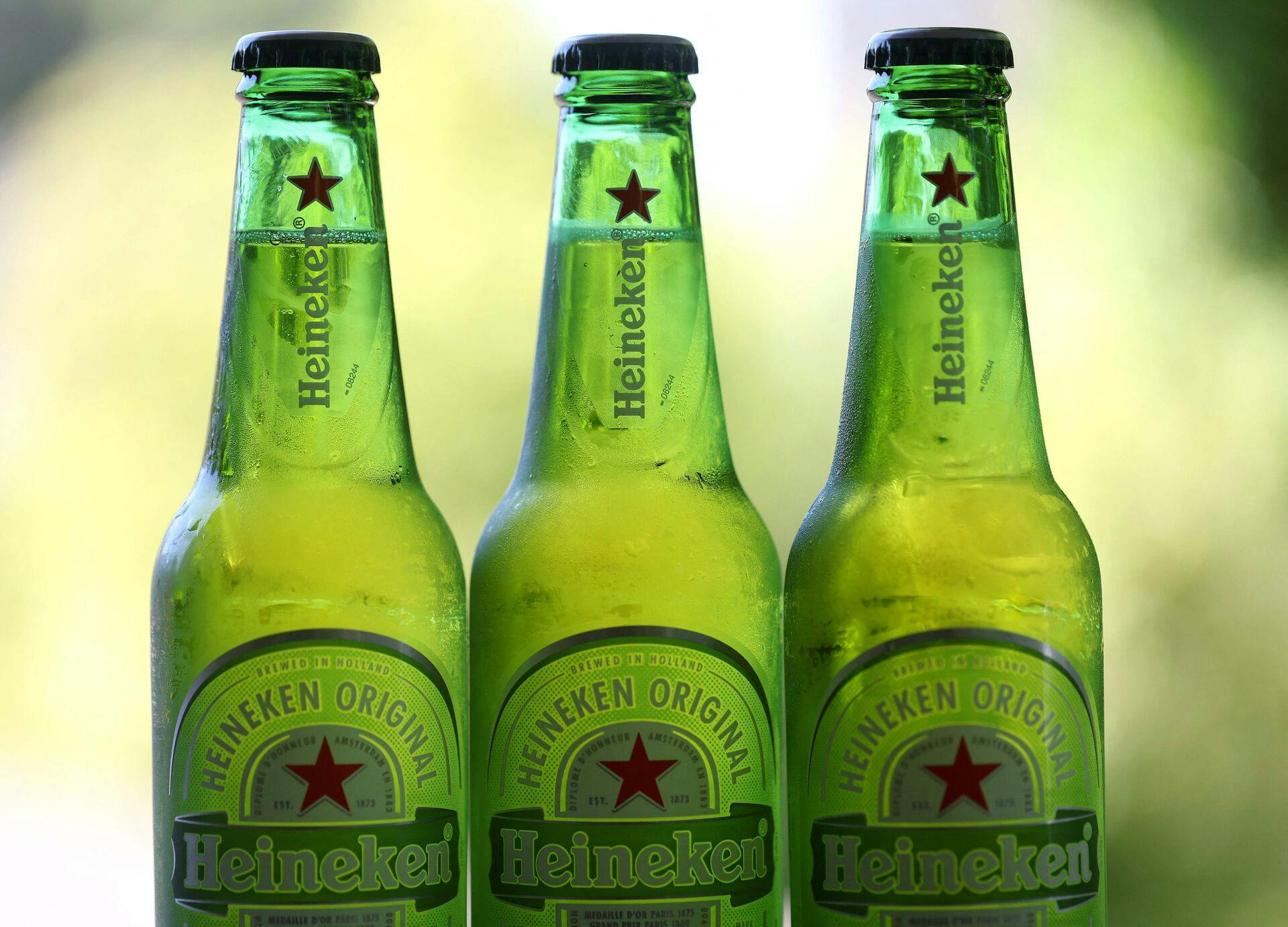 SAN ANSELMO, CALIFORNIA - JULY 31: In this photo illustration, bottles of Heineken beer are displayed on July 31, 2023 in San Anselmo, California. Dutch beer maker Heineken, the world's second-largest brewer by volume, cut its 2023 profit growth forecast following the economic slowdown in Vietnam that cut its first-half earnings. (Photo illustration by Justin Sullivan/Getty Images) (Photo by JUSTIN SULLIVAN / GETTY IMAGES NORTH AMERICA / Getty Images via AFP)