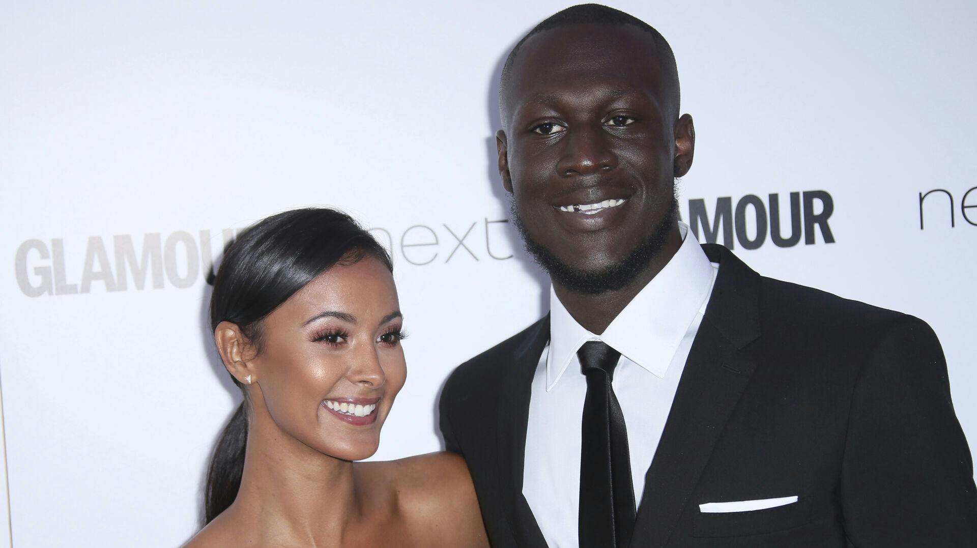 Stormzy and Maya Jama pose for photographers upon arrival at the Glamour Woman of the Year Awards in London, Tuesday, June 6, 2017. (Photo by Joel Ryan/Invision/AP)