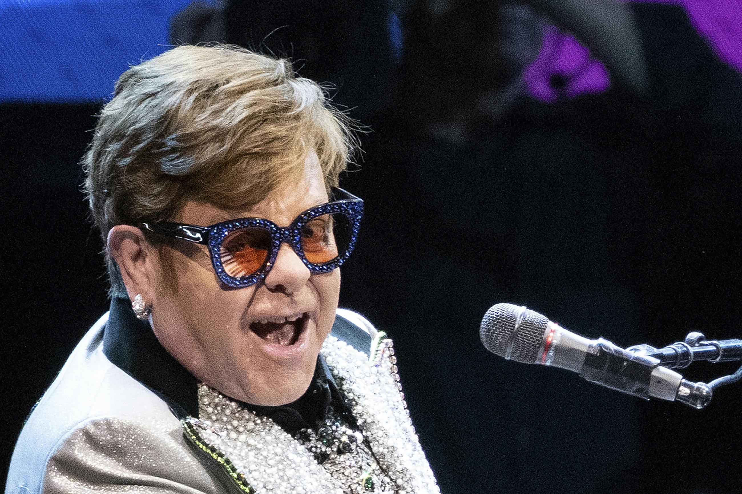 27 April 2023, Bavaria, Munich: Singer and pianist Elton John sits on stage at the Olympic Hall during a concert as part of his "Farewell Yellow Brick Road Tour 2023." (RECROP.) Photo by: Sven Hoppe/picture-alliance/dpa/AP Images