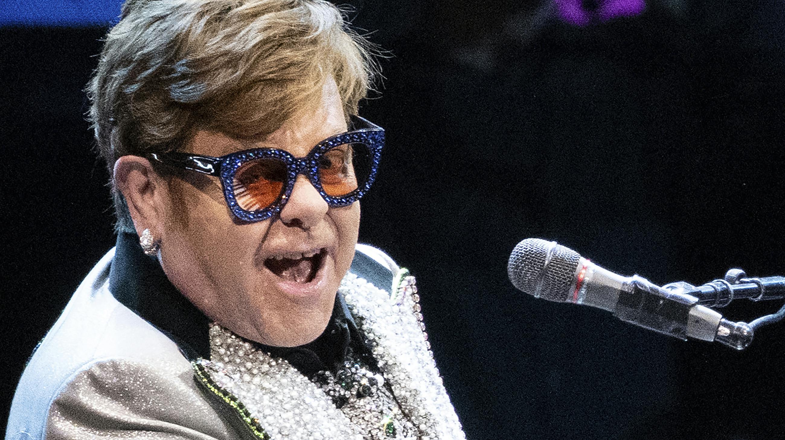 27 April 2023, Bavaria, Munich: Singer and pianist Elton John sits on stage at the Olympic Hall during a concert as part of his "Farewell Yellow Brick Road Tour 2023." (RECROP.) Photo by: Sven Hoppe/picture-alliance/dpa/AP Images