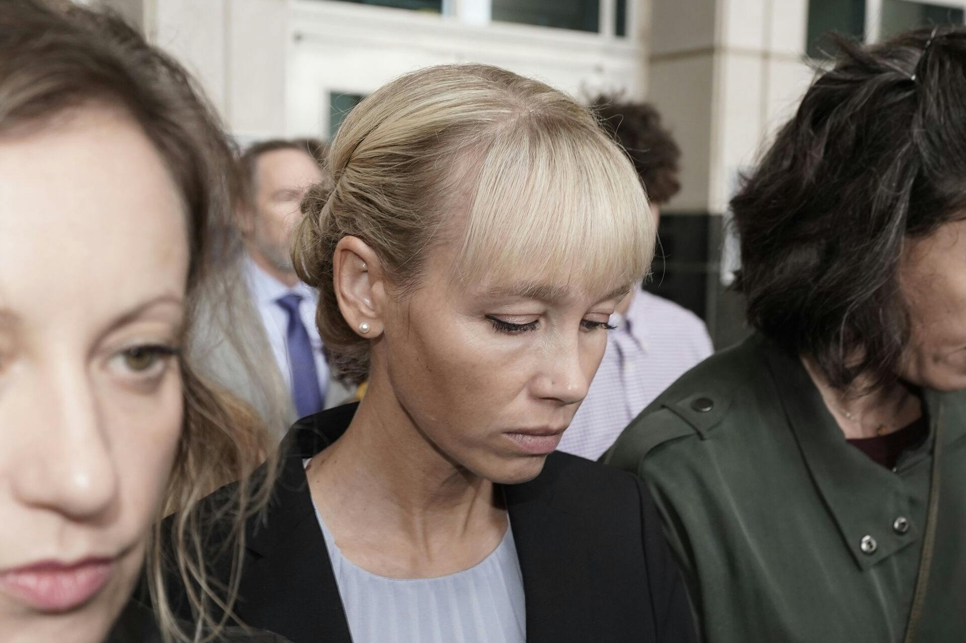 Sherri Papini leaves the federal courthouse after Federal Judge William Shubb sentenced her to 18 months in federal prison, in Sacramento, Calif., Monday, Sept. 19, 2022. Federal prosecutors had asked that she be sentenced to eight months in prison for faking her own kidnapping in 2016. (AP Photo/Rich Pedroncelli)