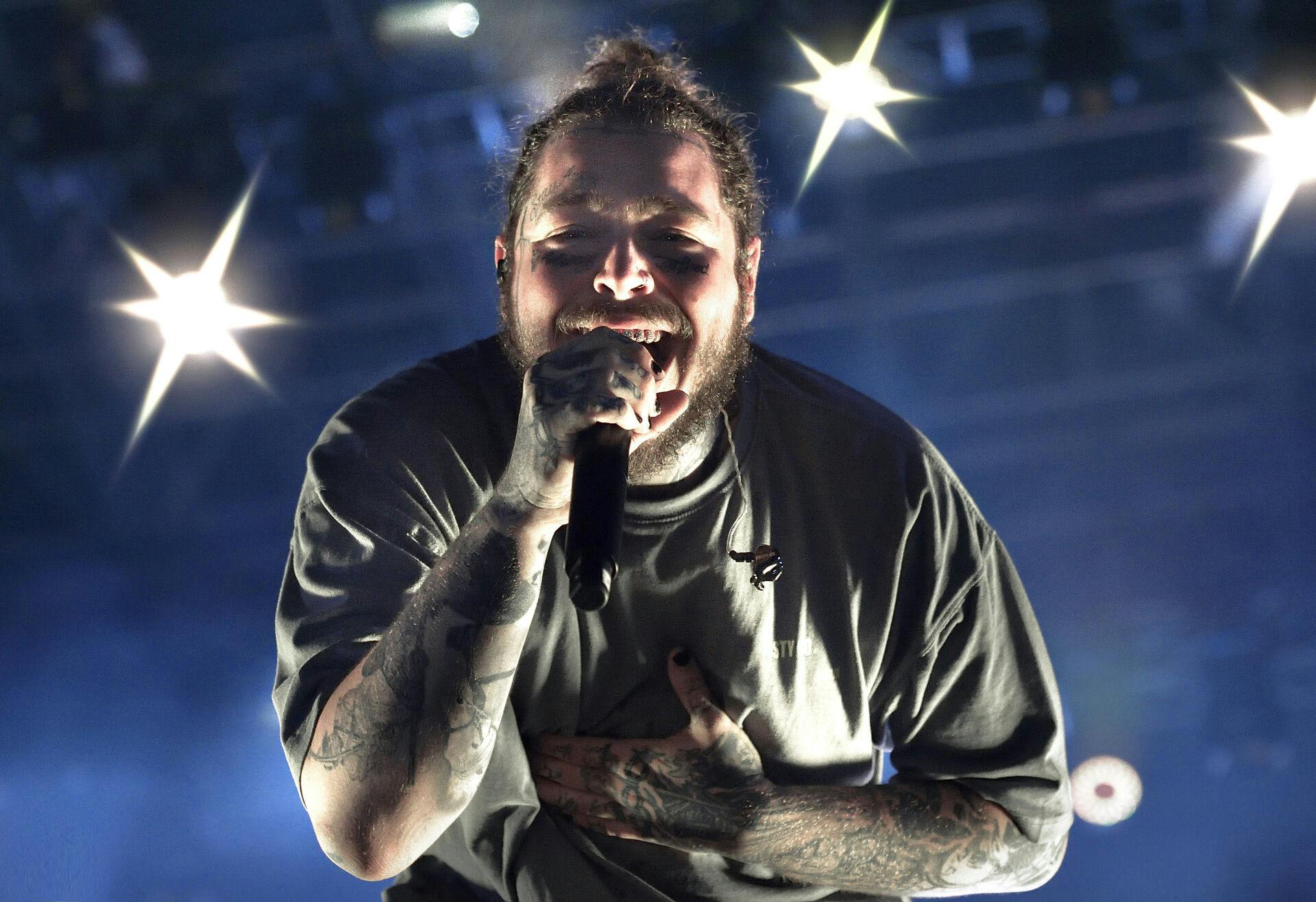 Post Malone Artist of the Year 2020 Billboard Music Awards: Post Malone records 9 statuettes was the big winner of the 2020 Billboard Music Awards. He won nine awards, including Artist of the Year. Photo performing live on stage in Rome at Rock in Roma festival in Rome, Italy on 11 July 2018. Photo by Rocco Spaziani | usage worldwide Photo by: Rocco Spaziani/picture-alliance/dpa/AP Images