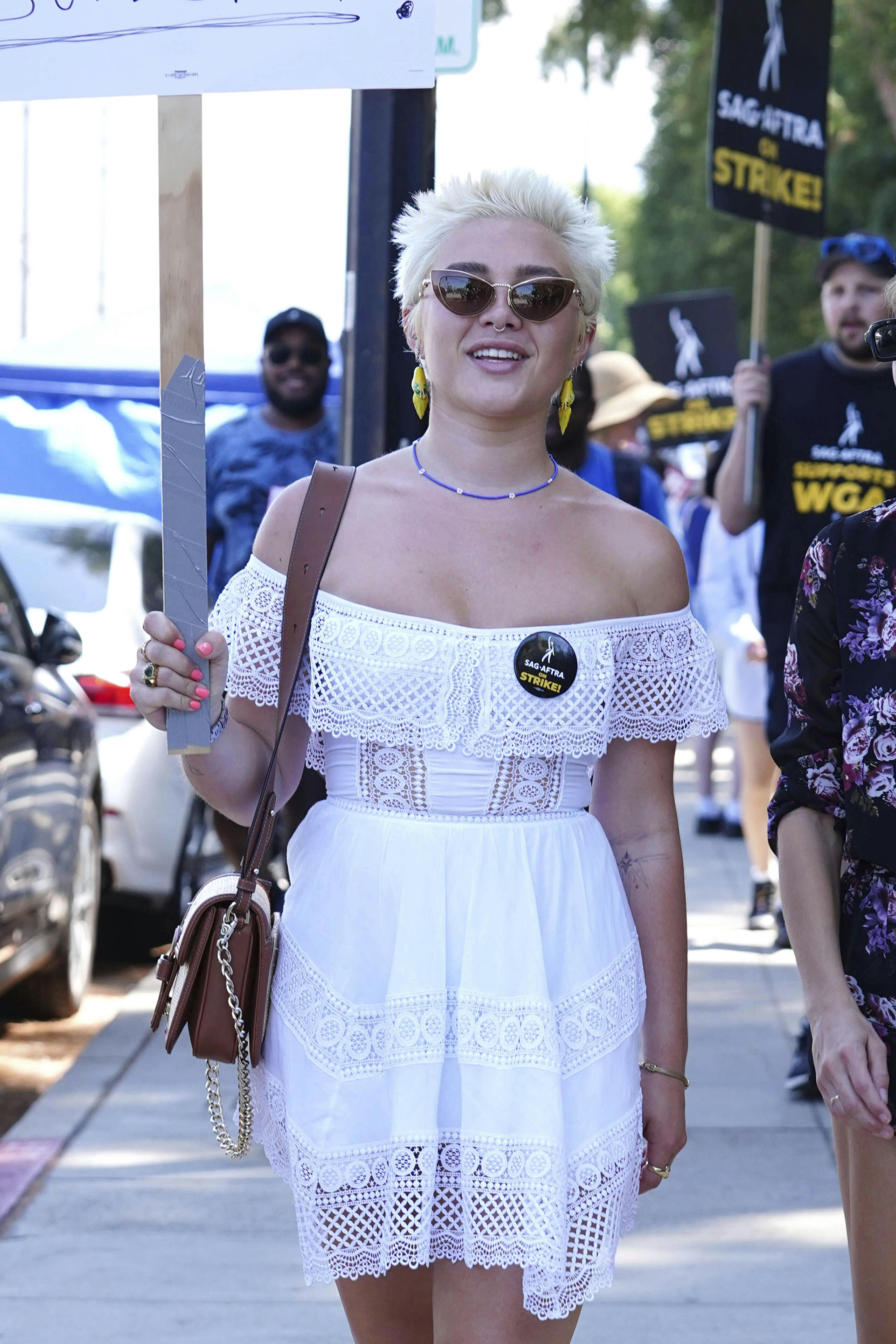 Photo by: gotpap/STAR MAX/IPx 2023 8/15/23 Florence Pugh walks the picket line in support of the SAG-AFTRA and WGA strike at Disney Studios on August 15, 2023 in Burbank, California.