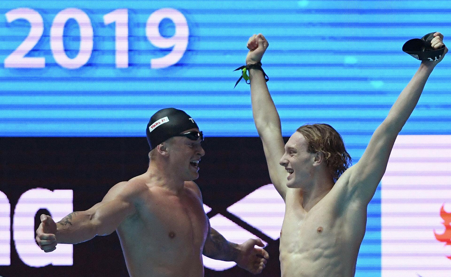 Britain's Adam Peaty (L) and Britain's Luke Greenbank