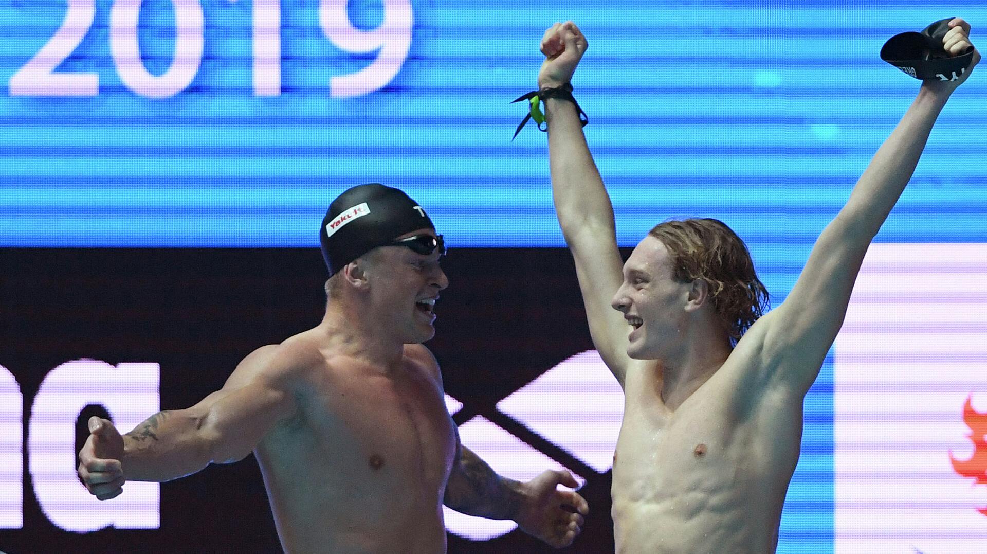 Britain's Adam Peaty (L) and Britain's Luke Greenbank
