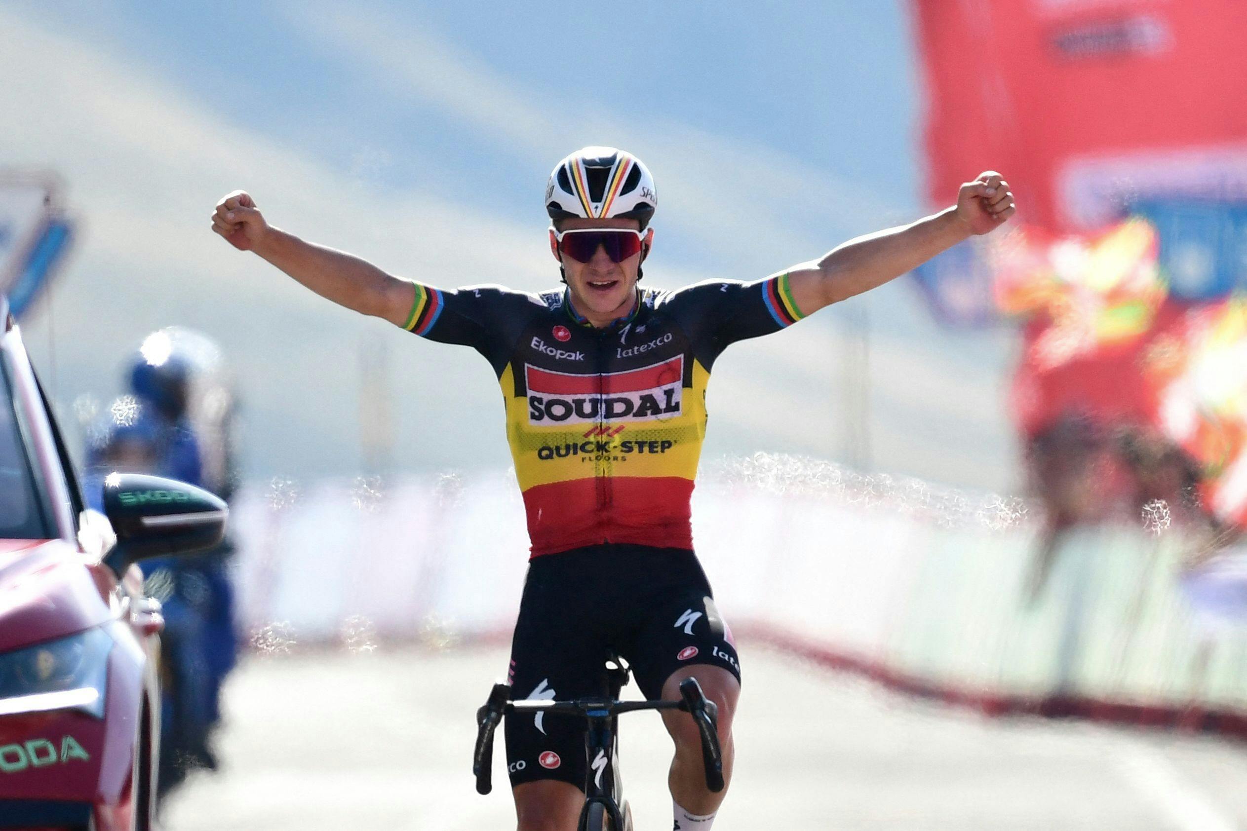 Team Quick Step's Belgian rider Remco Evenepoel celebrates winning the stage 14 of the 2023 La Vuelta cycling tour of Spain, a 156, 2 km race between Sauveterre-de-Bearn and Larra Belagua, on September 9, 2023. (Photo by ANDER GILLENEA / AFP)