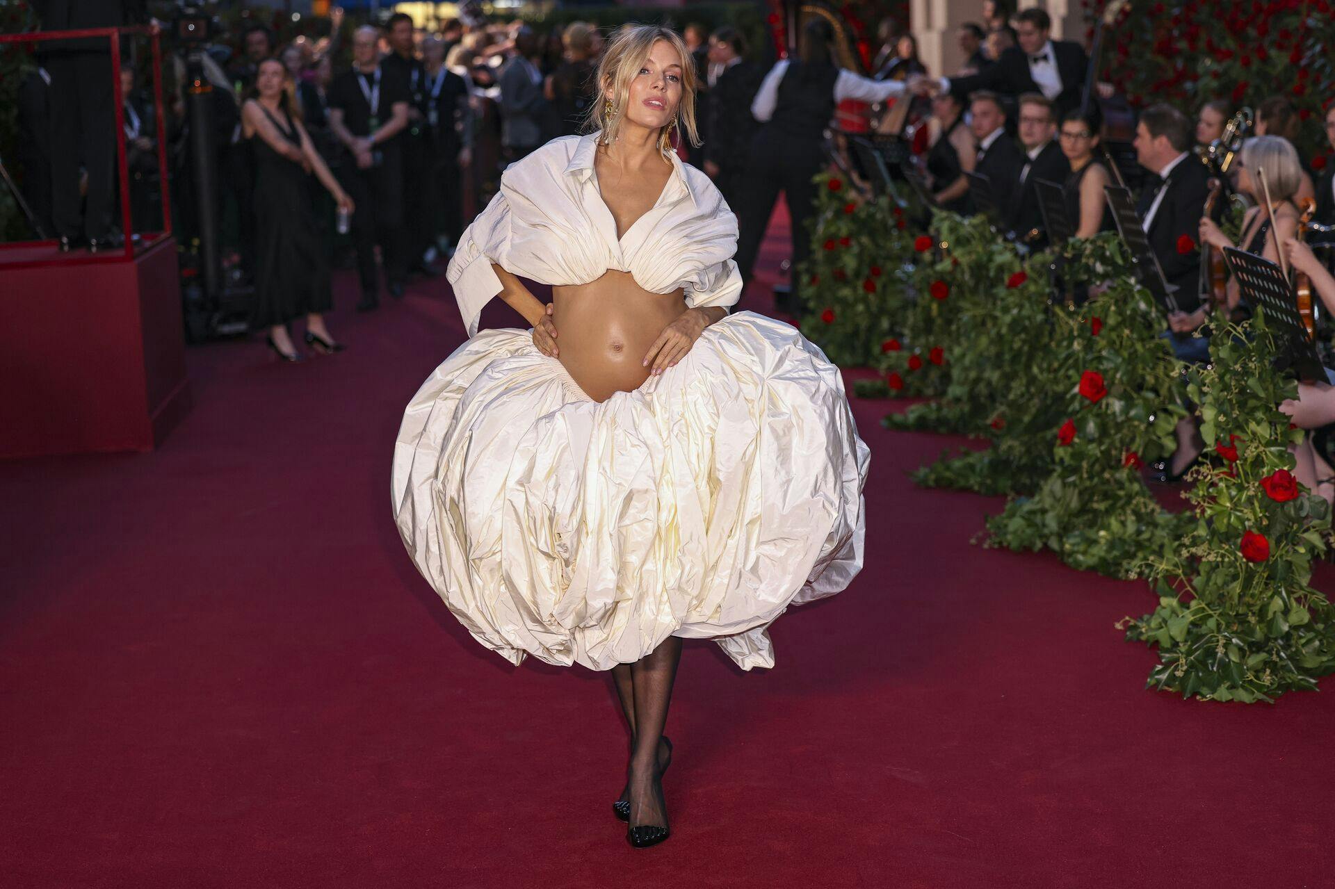 Sienna Miller poses for photographers upon arrival at the Vogue World event on Thursday, Sept. 14, 2023 in London. (Vianney Le Caer/Invision/AP)