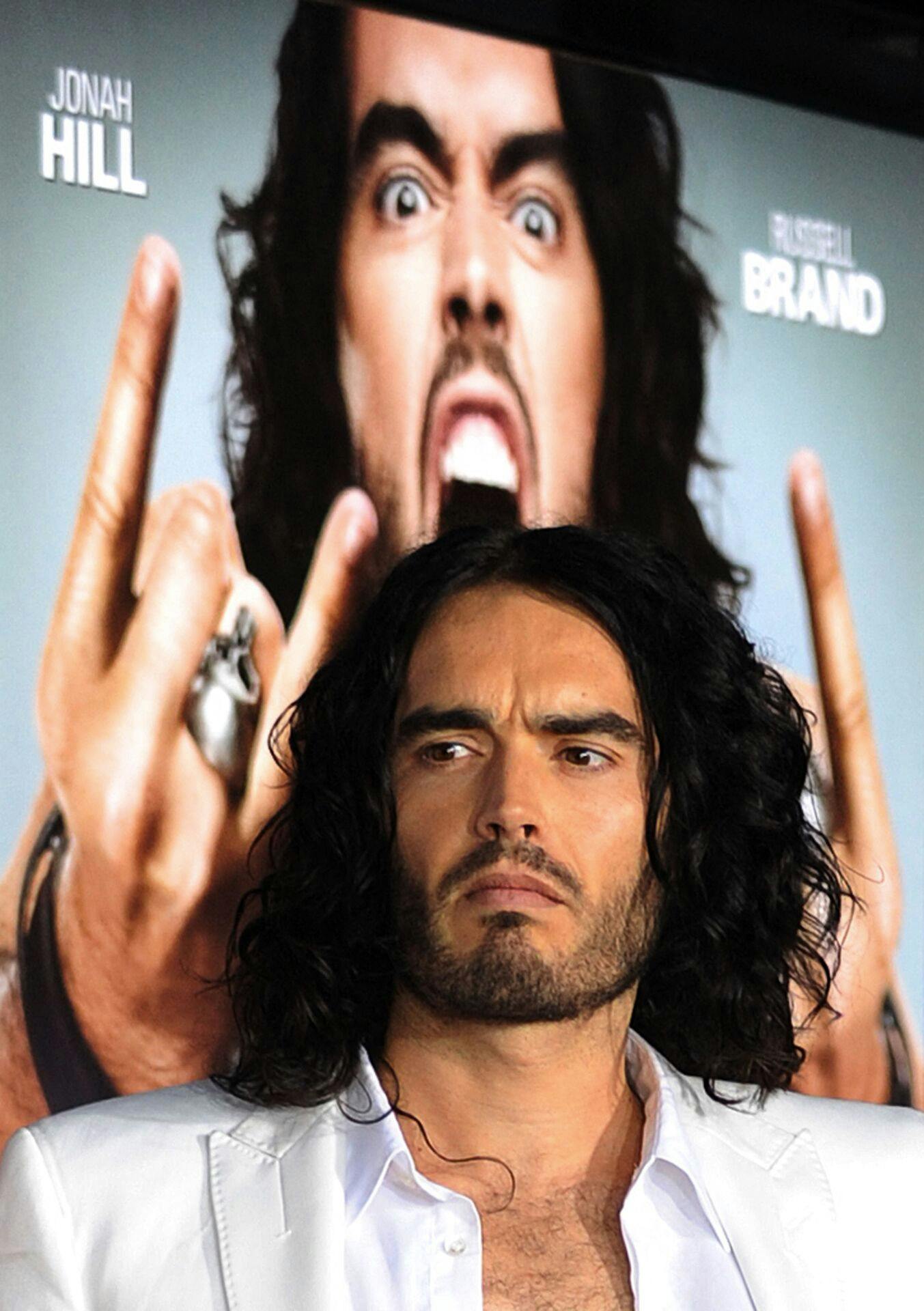 (FILES) Actor Russell Brand poses on the red carpet as he arrives for the premiere of the comedy movie "Get Him to the Greek" from Universal Pictures at the Greek Theatre in Los Angeles on May 25, 2010. British comedian and actor Russell Brand has been accused of rape, sexual assaults and emotional abuse during a seven-year period, according to the results of a media investigation published on September 16, 2023. (Photo by MARK RALSTON / AFP)