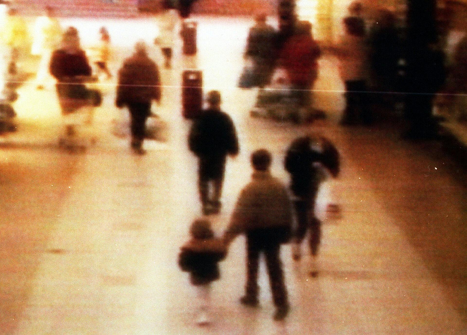 A video still of James Bulger, aged 2 years old, being led away in the 'New Strand' shopping centre in the Bootle area of Liverpool.