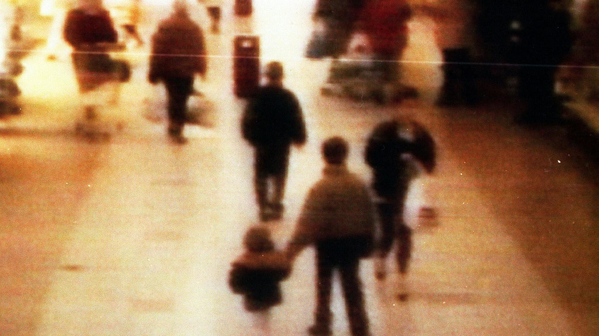 A video still of James Bulger, aged 2 years old, being led away in the 'New Strand' shopping centre in the Bootle area of Liverpool.