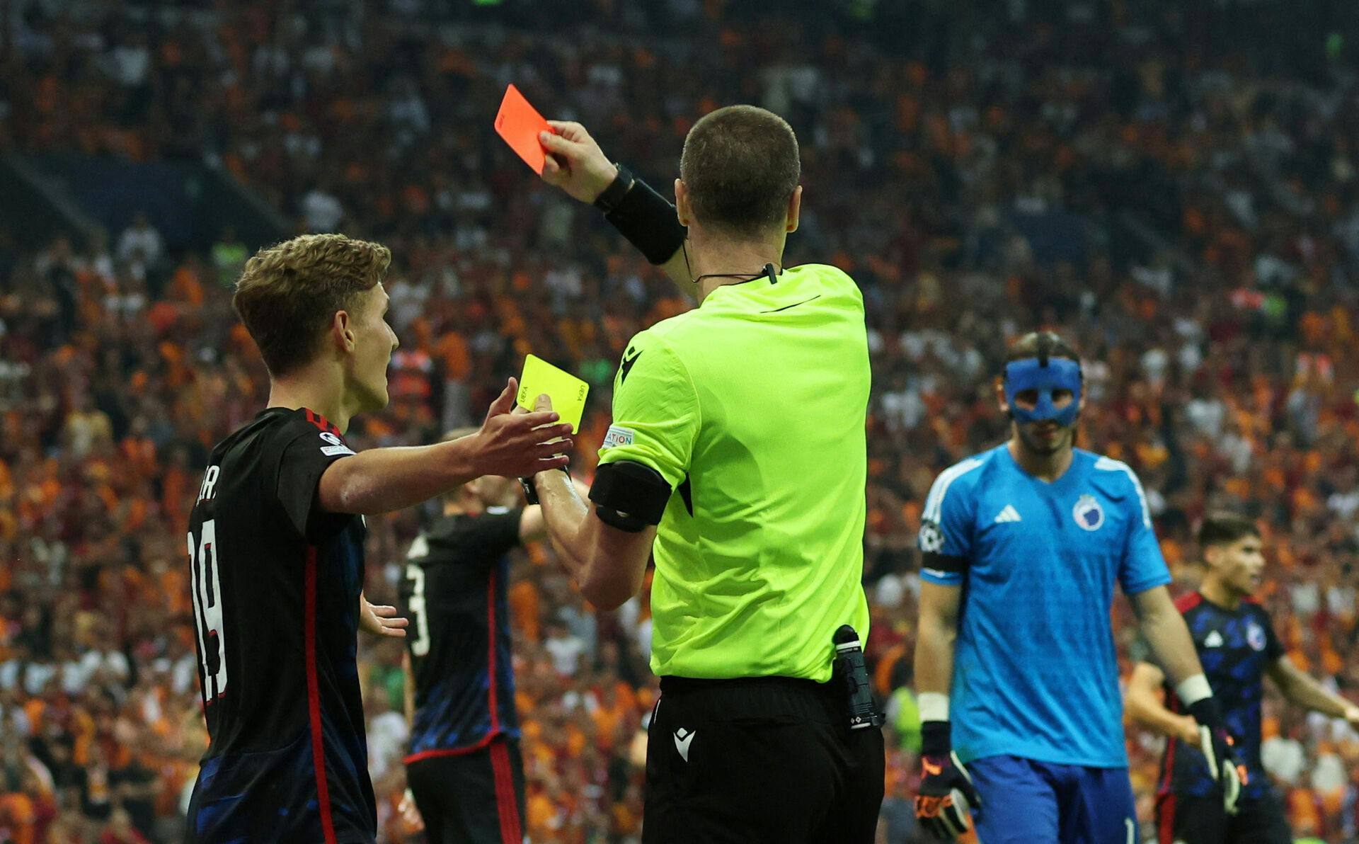 Soccer Football - Champions League - Group A - Galatasaray v FC Copenhagen - Rams Park, Istanbul, Turkey - September 20, 2023 FC Copenhagen's Elias Jelert is shown a red card by referee Georgi Kabakov REUTERS/Murad Sezer