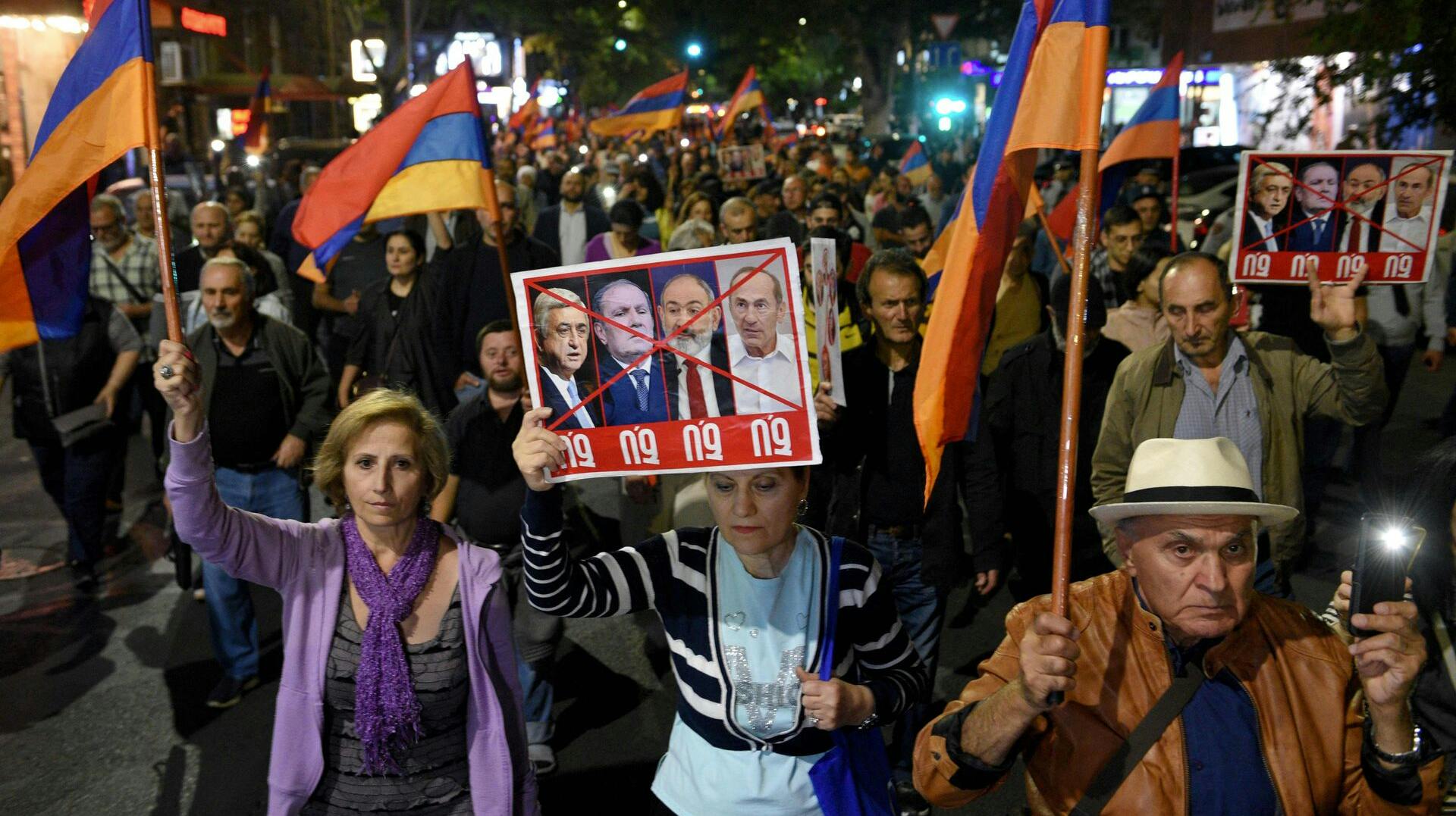 People take part in an anti-government rally in downtown Yerevan on September 25, 2023, following Azerbaijani military operations against Armenian separatist forces in Nagorno-Karabakh. (Photo by KAREN MINASYAN / AFP)