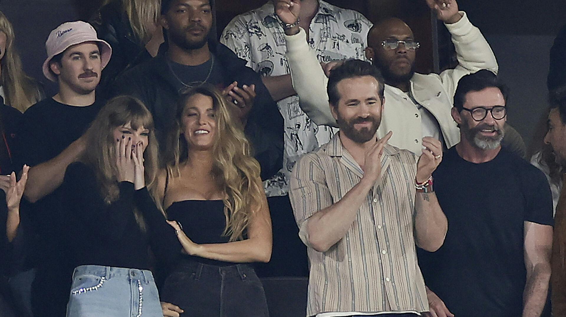 From left, Taylor Swift, Blake Lively and Ryan Reynolds react during the first quarter of an NFL football game between the New York Jets and the Kansas City Chiefs, Sunday, Oct. 1, 2023, in East Rutherford, N.J. (AP Photo/Adam Hunger)