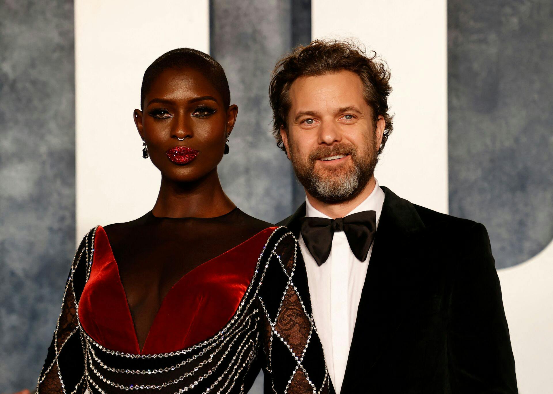 (L-R) British actress Jodie Turner-Smith and her husband, Canadian-US actor Joshua Jackson, attend the Vanity Fair 95th Oscars Party at the The Wallis Annenberg Center for the Performing Arts in Beverly Hills, California on March 12, 2023. (Photo by Michael TRAN / AFP)