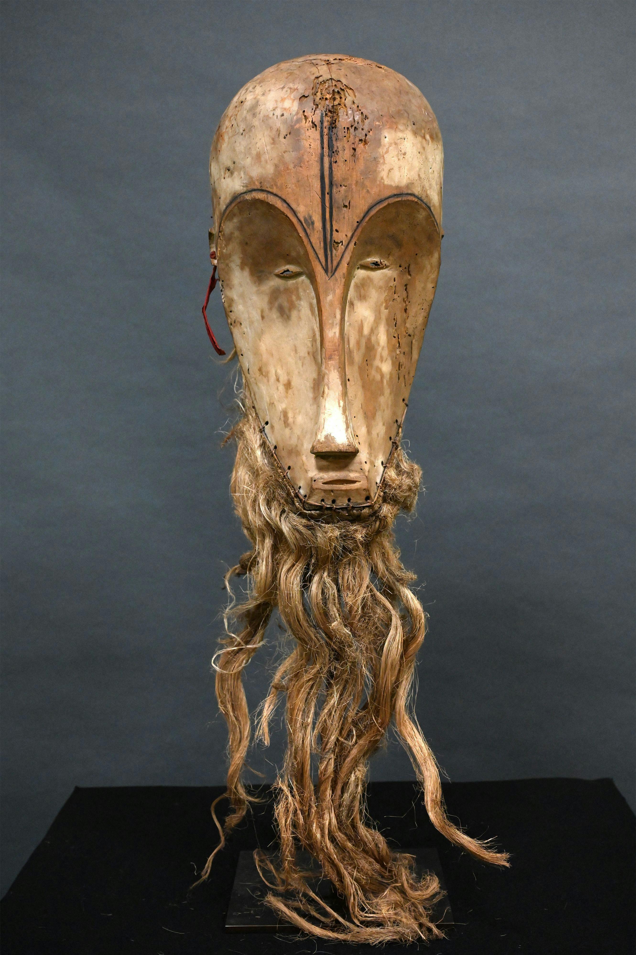 (FILES) This photograph taken on March 24, 2022 shows a "Ngil" mask of the Fang people of Gabon which is estimated at 300, 000/400, 000 euros and which will be auctioned on March 26, 2022 at the Montpellier auction house. A retired couple from the south of France have taken legal action to overturn the sale of a Central African mask they owned to a secondhand dealer for 150 euros, which was subsequently resold for over four million euros. (Photo by Pascal GUYOT / AFP)