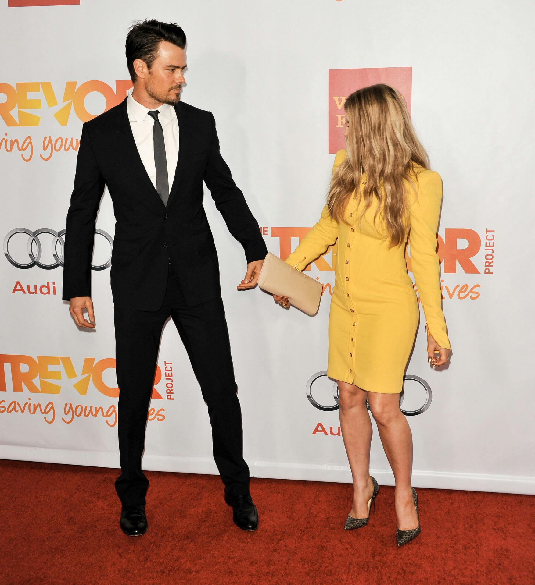 Josh Duhamel, left, and Fergie arrive at TrevorLIVE Los Angeles Benefit at the Hollywood Palladium, on Sunday, December, 8, 2013 in Los Angeles, Calif. (Photo by Richard Shotwell/Invision/AP)