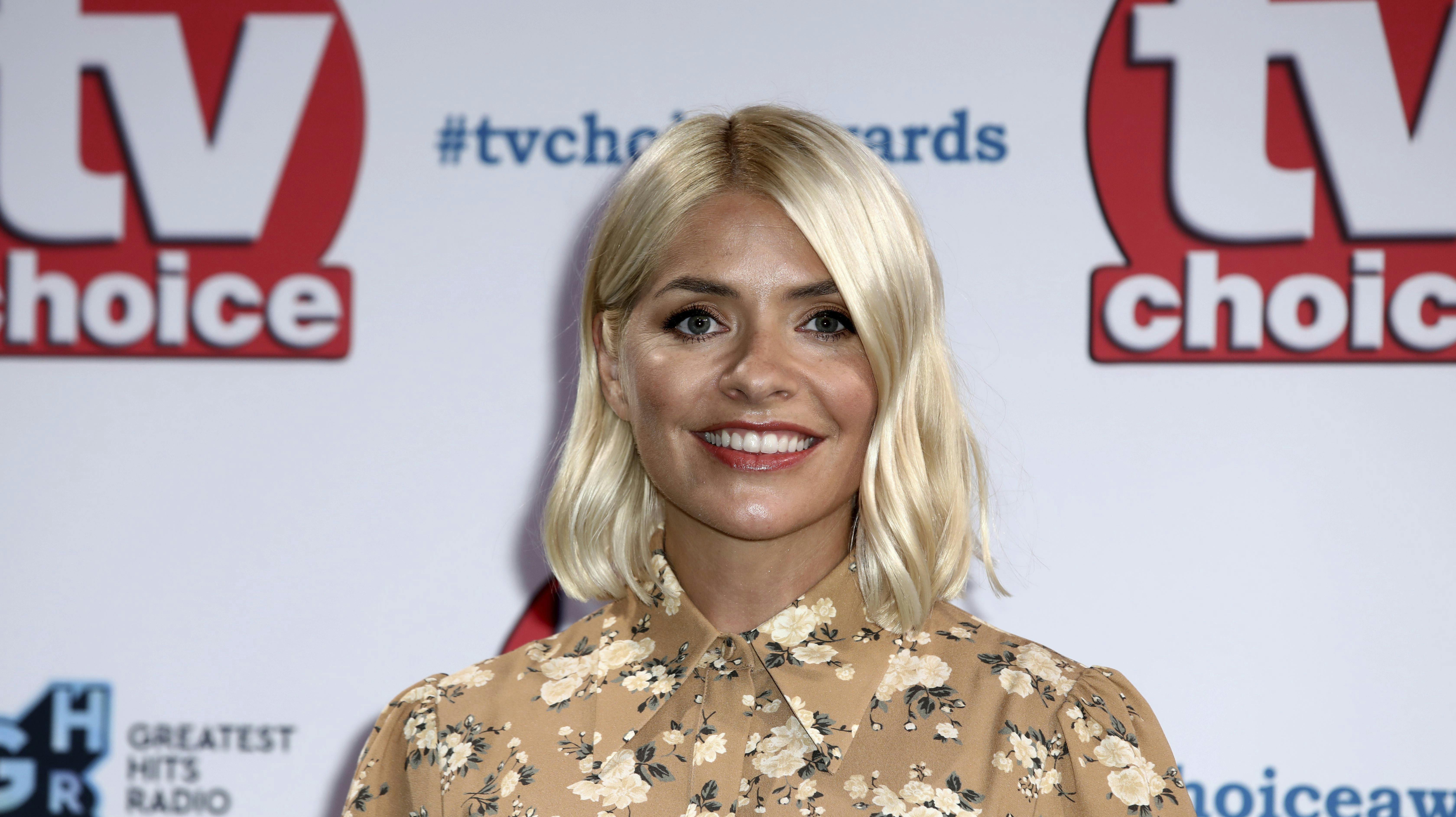 TV Presenter Holly Willoughby poses for photographers on arrival at the TV Choice Awards in central London on Monday, Sept. 9, 2019. (Photo by Grant Pollard/Invision/AP)