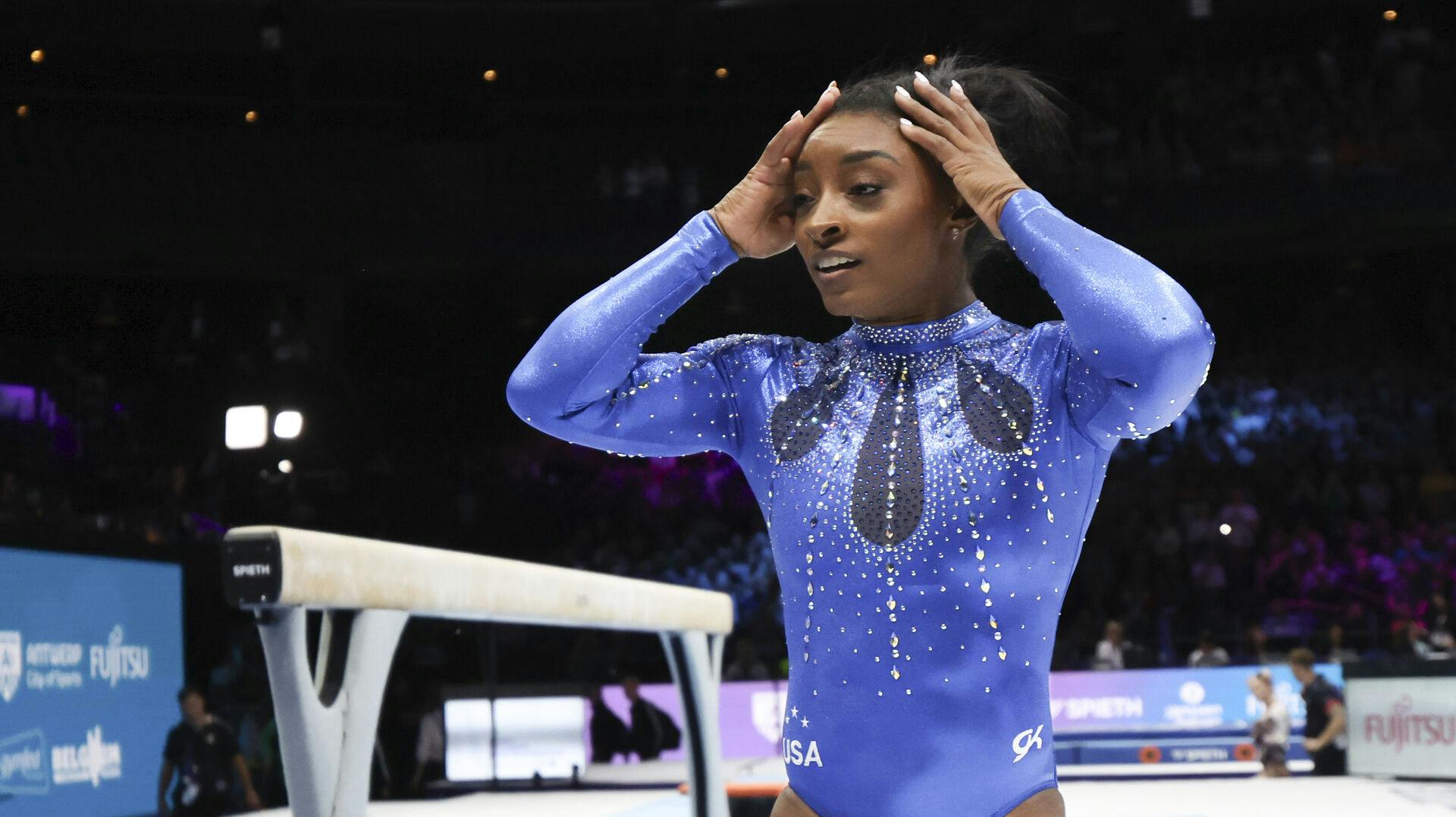 United States' Simone Biles, who won the gold medal, reacts after the women's all-round final at the Artistic Gymnastics World Championships in Antwerp, Belgium, Friday, Oct. 6, 2023. (AP Photo/Geert vanden Wijngaert)