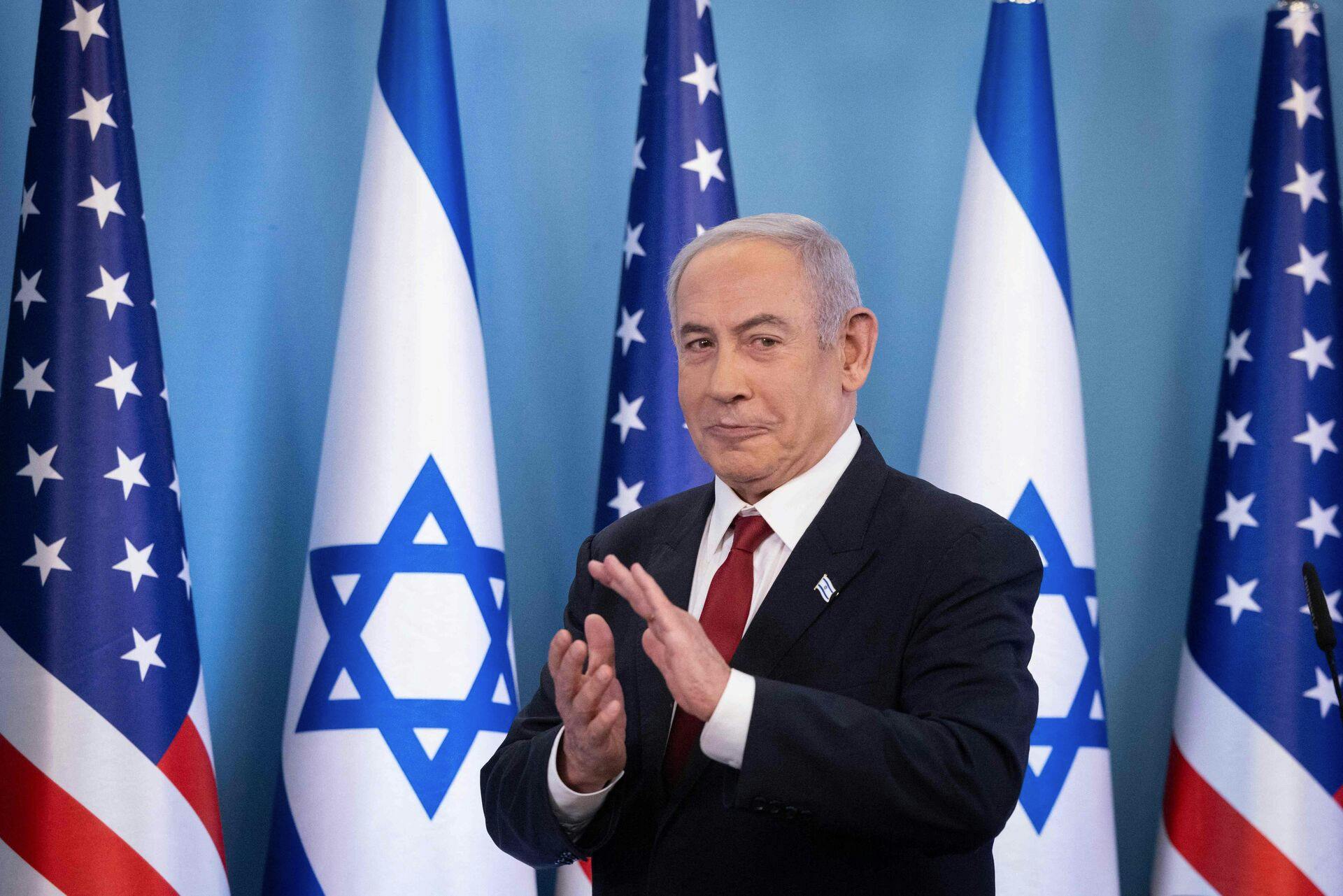 Israeli Prime Minister Benjamin Netanyahu reacts during an event marking the acceptance of Israel into the United States government's visa waiver program, in Jerusalem on September 28, 2023. (Photo by Chaim Goldberg / POOL / AFP)