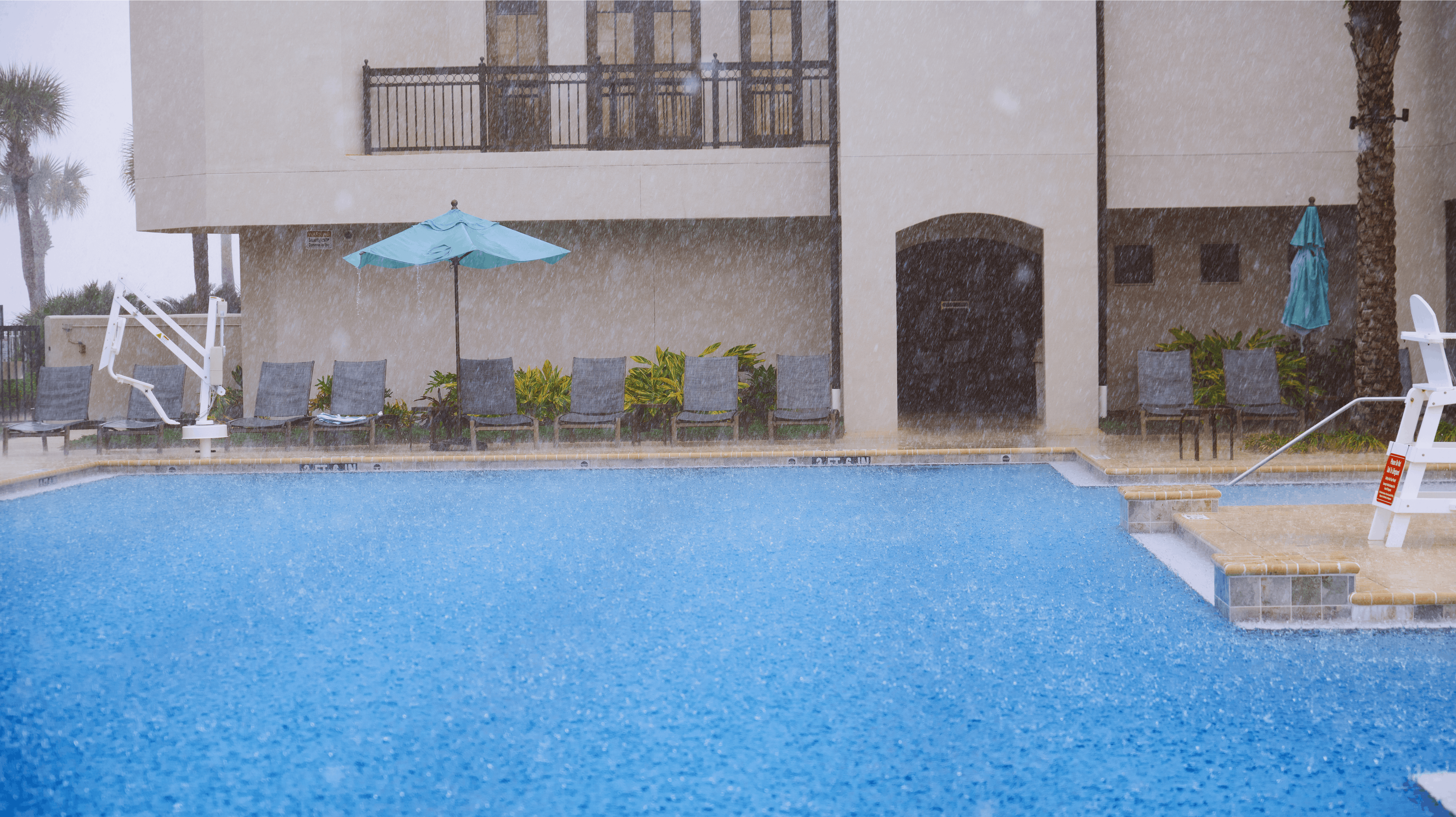 Outdoors swimming pool under the heavy rain