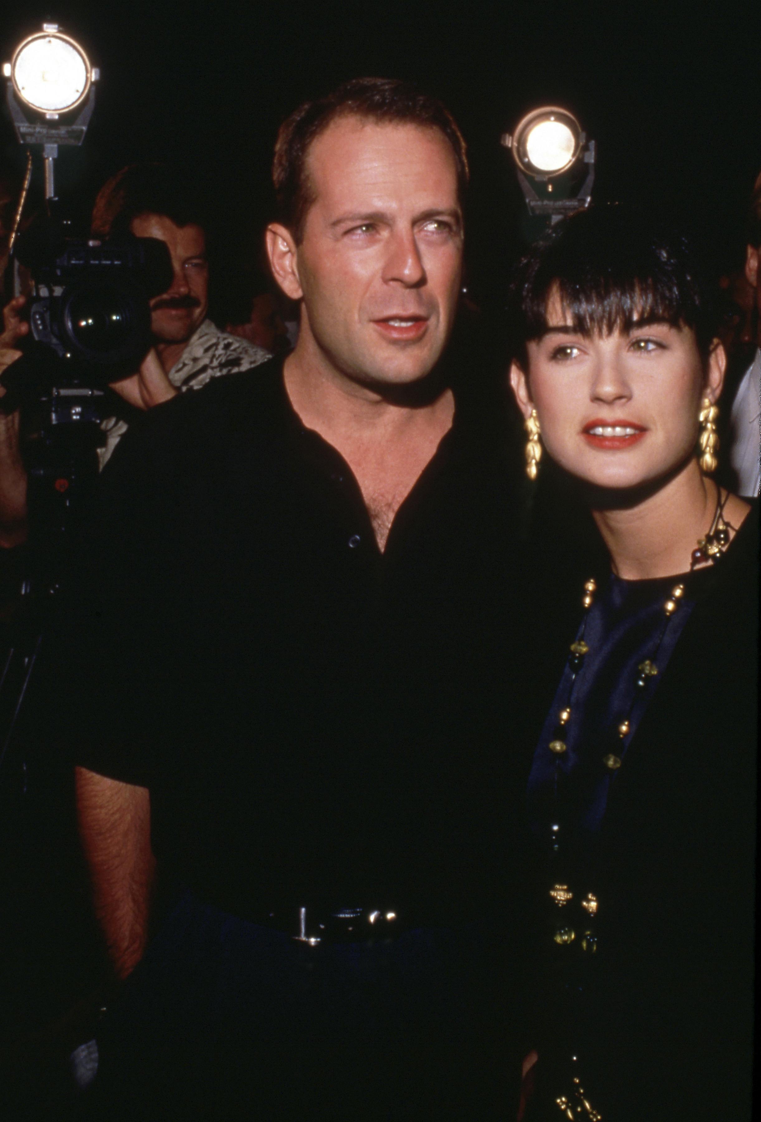 **FILE PHOTO** Bruce Willis' Family Announce Dementia Diagnosis. Bruce Willis and Demi Moore at the In Country Premiere on September 14, 1989 at the Academy Theatre in Beverly Hills, California Credit: Ralph Dominguez/MediaPunch /IPX