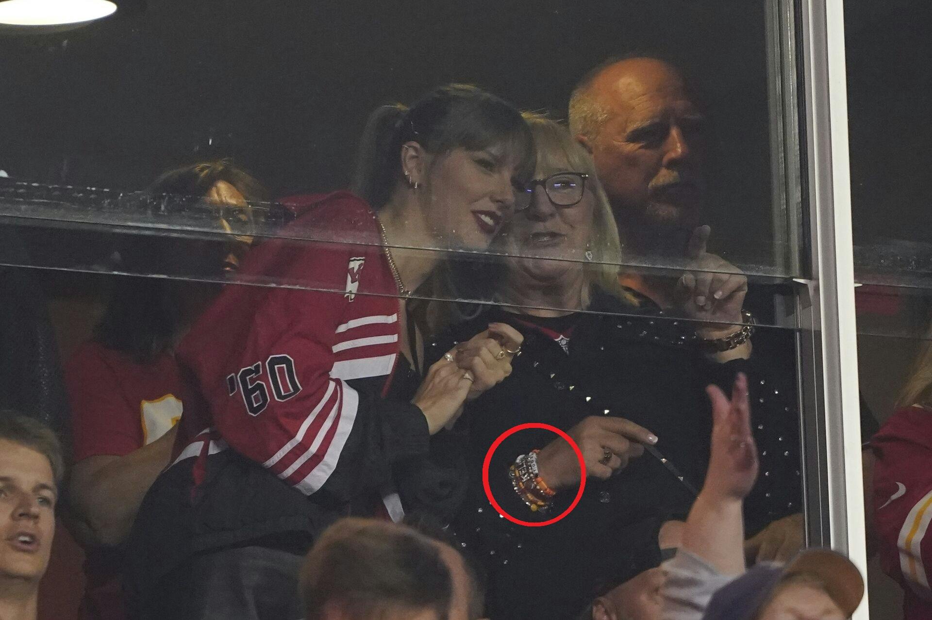 Taylor Swift and Donna Kelce talk during the first half of an NFL football game between the Kansas City Chiefs and the Denver Broncos, Thursday, Oct. 12, 2023, in Kansas City, Mo. (AP Photo/Ed Zurga)