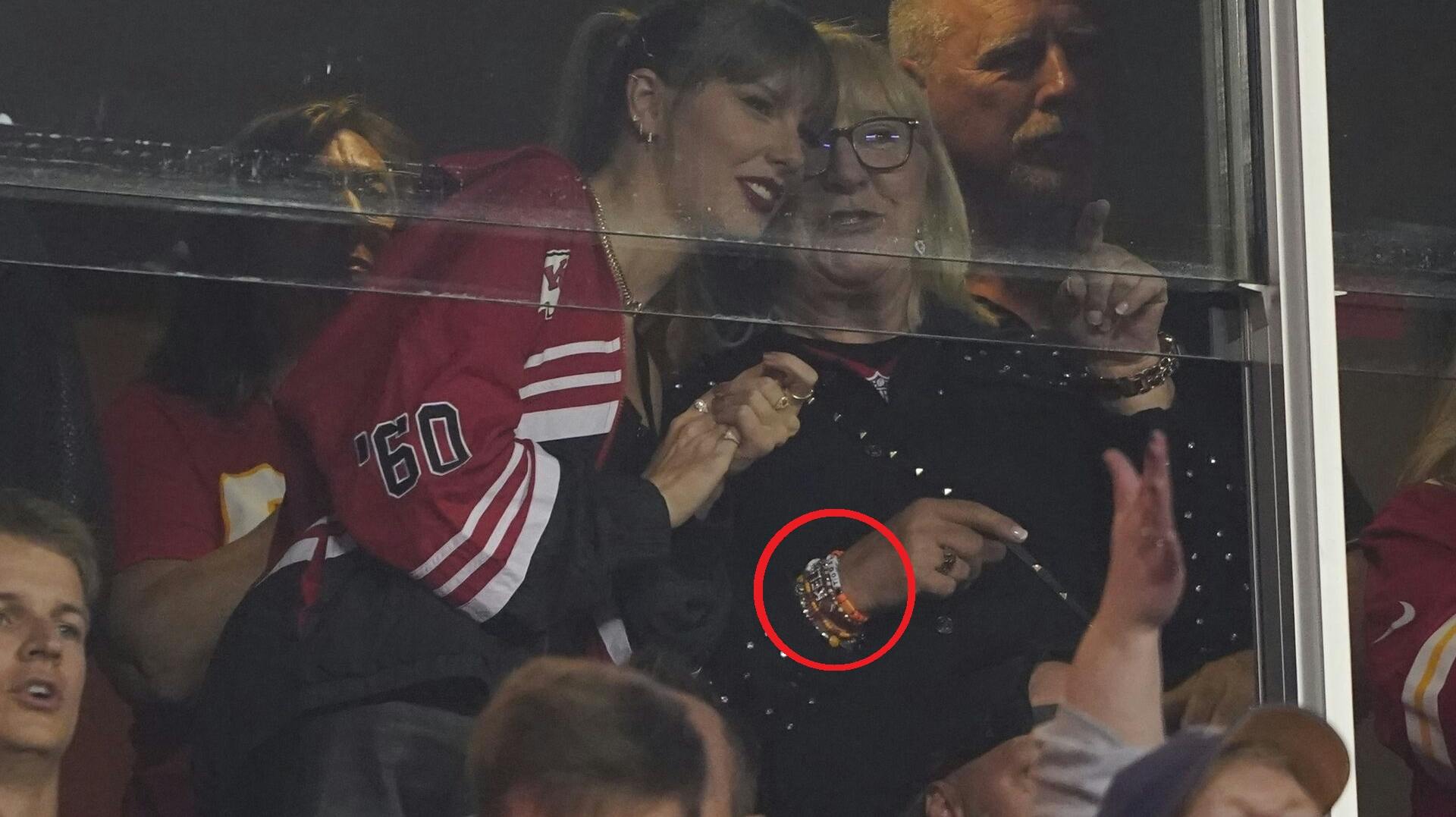 Taylor Swift and Donna Kelce talk during the first half of an NFL football game between the Kansas City Chiefs and the Denver Broncos, Thursday, Oct. 12, 2023, in Kansas City, Mo. (AP Photo/Ed Zurga)