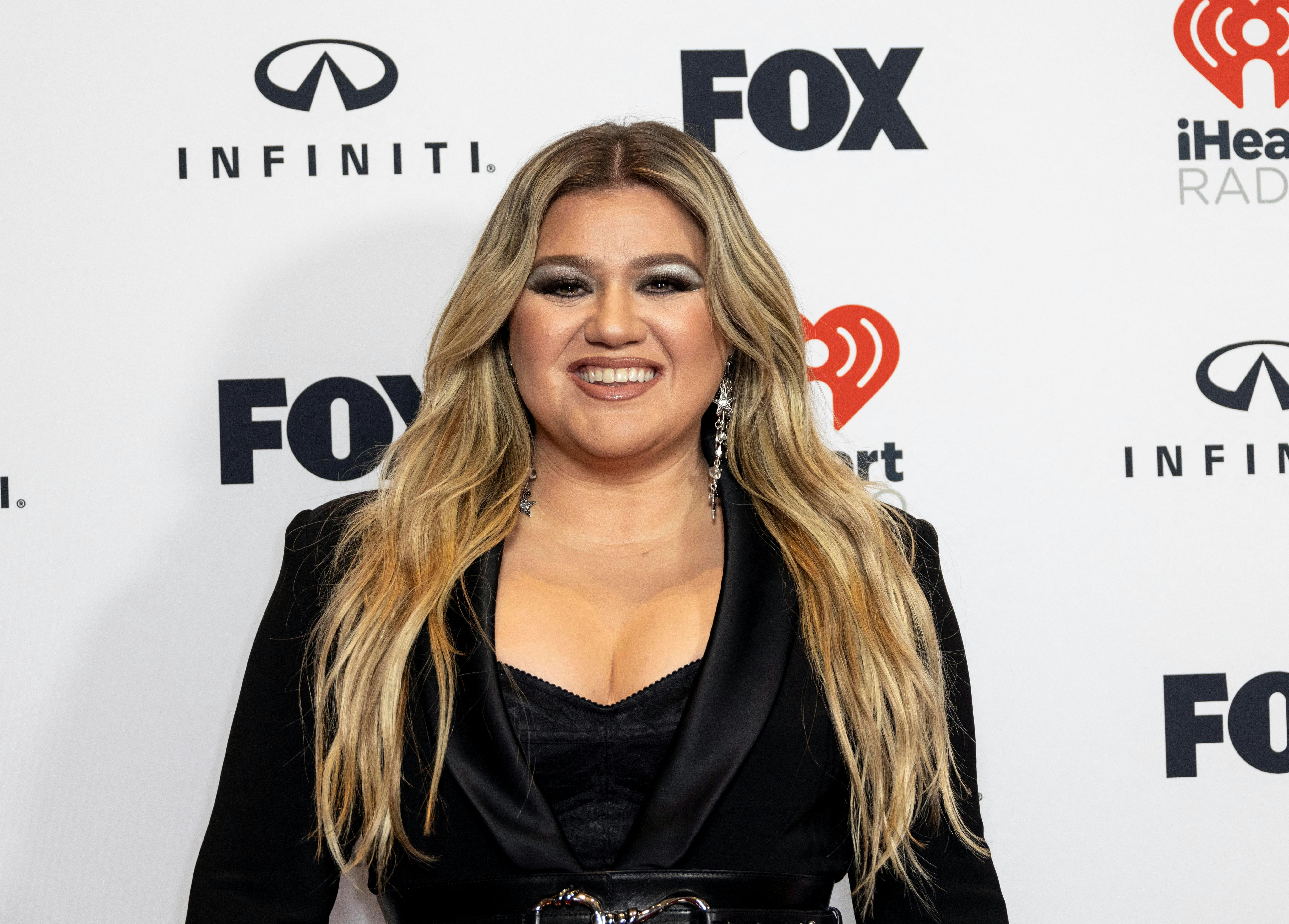 Kelly Clarkson poses during the iHeartRadio Music Awards in Los Angeles, California, U.S. March 27, 2023. REUTERS/Aude Guerrucci