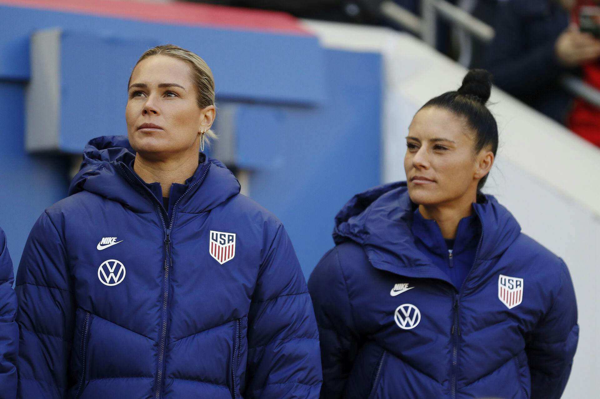 United States goalkeeper Ashlyn Harris, left, and United States defender Ali Krieger look out from the bench before the first half of a SheBelieves Cup soccer match against Spain Sunday, March 8, 2020, in Harrison, N.J. The United States won 1-0. (AP Photo/Steve Luciano)