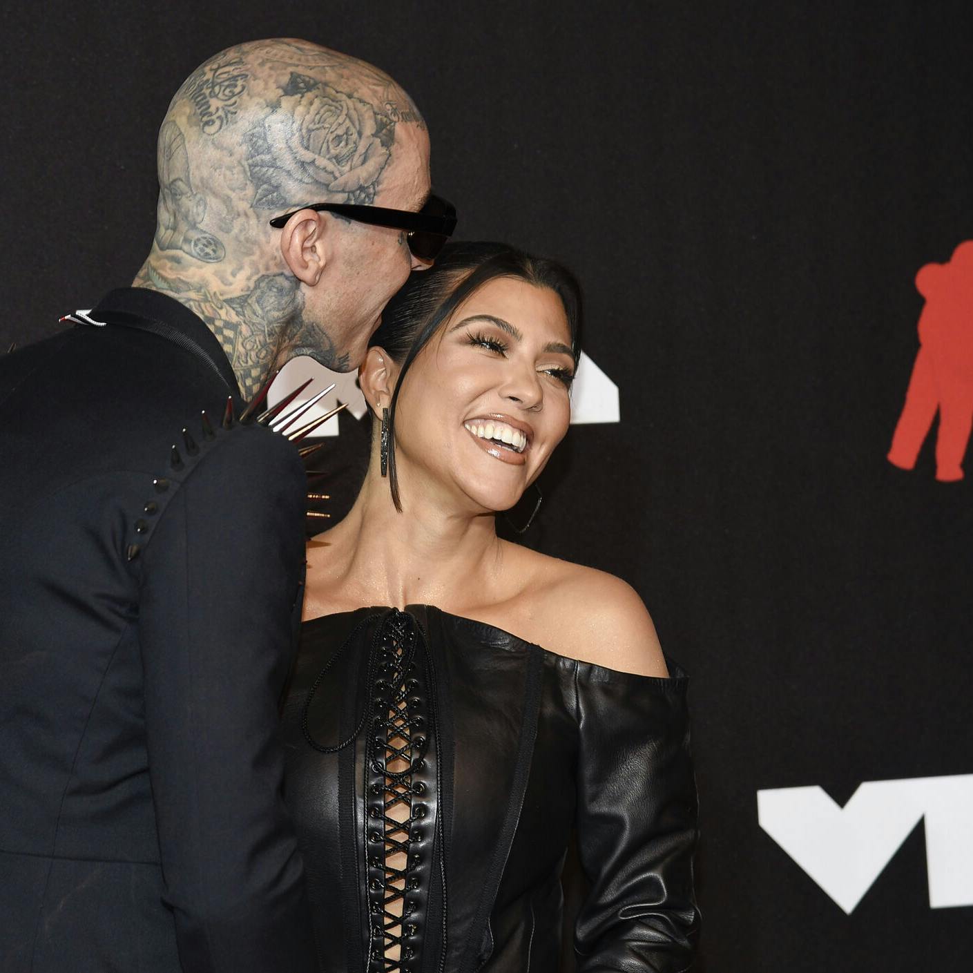 Travis Barker, left, and Kourtney Kardashian arrive at the MTV Video Music Awards at Barclays Center on Sunday, Sept. 12, 2021, in New York. (Photo by Evan Agostini/Invision/AP)