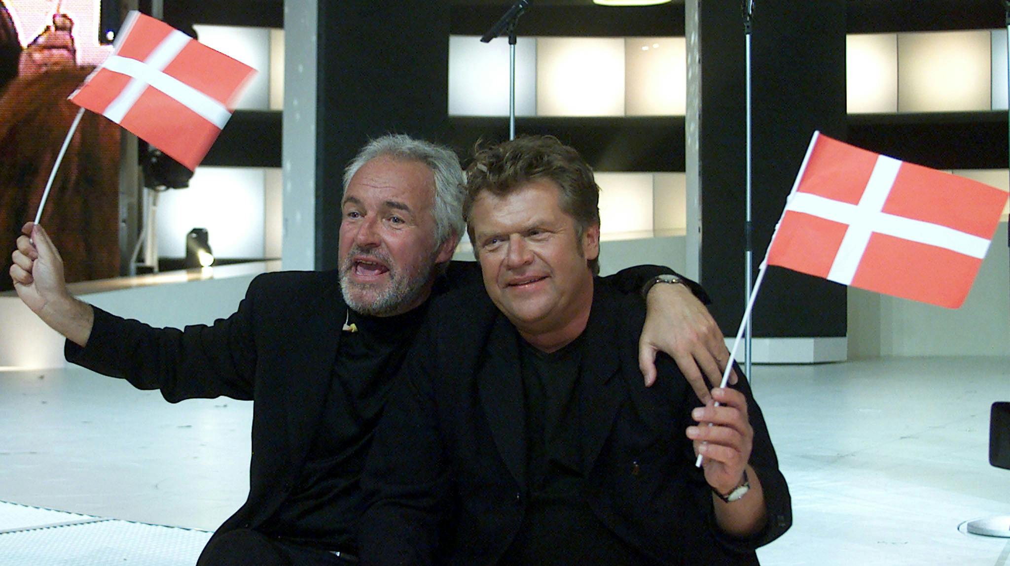 Jørgen Olsen (L) and his brother Niels from Denmark wave Danish flags after they won the Grand Prix Eurovision Song Contest 2000 in Stockholm May 13. The Olsen brothers won with their song "Fly on the wings of love".