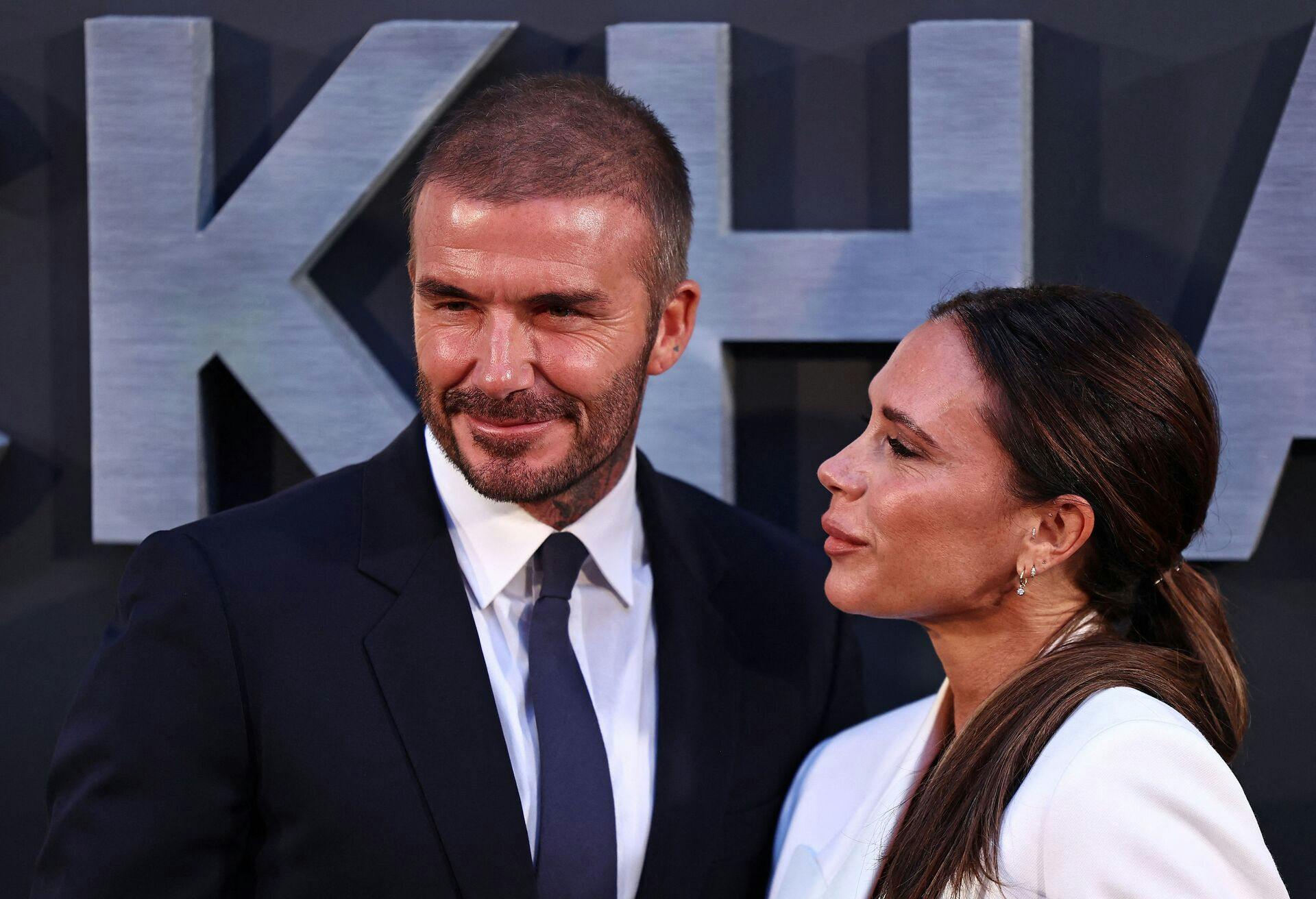 Former England footballer David Beckham and his wife Victoria Beckham pose on the red carpet upon arrival to attend the Premiere of "Beckham" in London on October 3, 2023. (Photo by HENRY NICHOLLS / AFP)