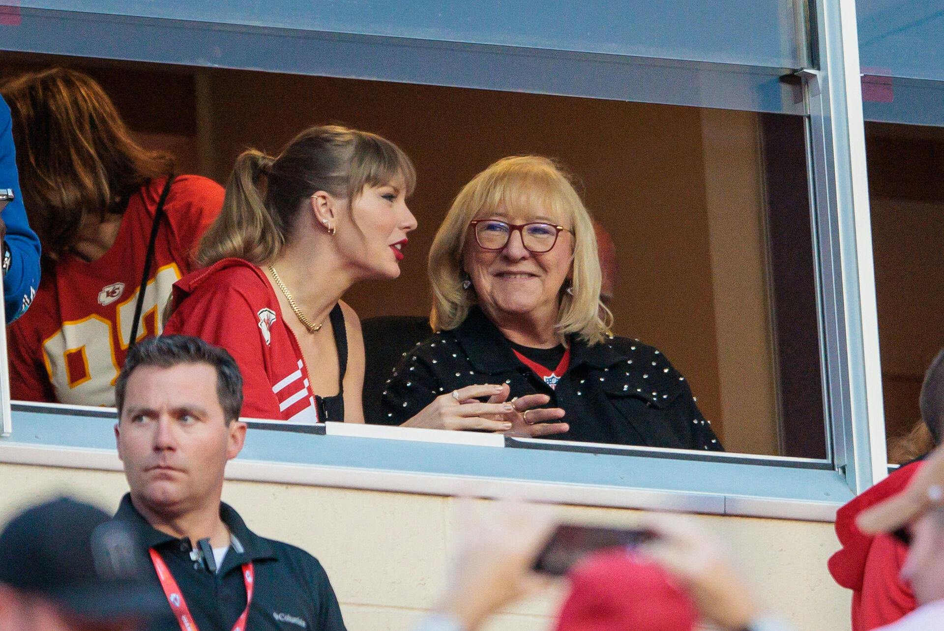 Oct 12, 2023; Kansas City, Missouri, USA; Grammy award winning artist Taylor Swift watches Kansas City Chiefs take the field along with Kansas City Chiefs tight end Travis Kelce (87) mom Donna Kelce prior to the game against the Denver Broncos at GEHA Field at Arrowhead Stadium. Mandatory Credit: William Purnell-USA TODAY Sports