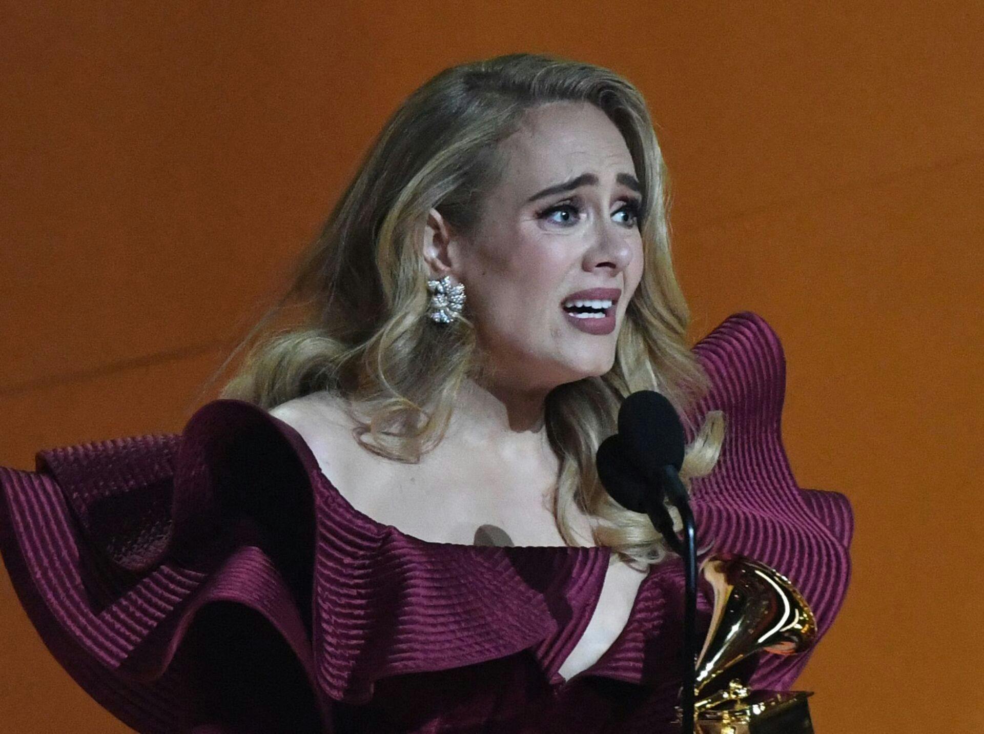 English singer-songwriter Adele accepts the award for Best Pop Solo Performance for "Easy on Me" during the 65th Annual Grammy Awards at the Crypto.com Arena in Los Angeles on February 5, 2023. (Photo by VALERIE MACON / AFP)
