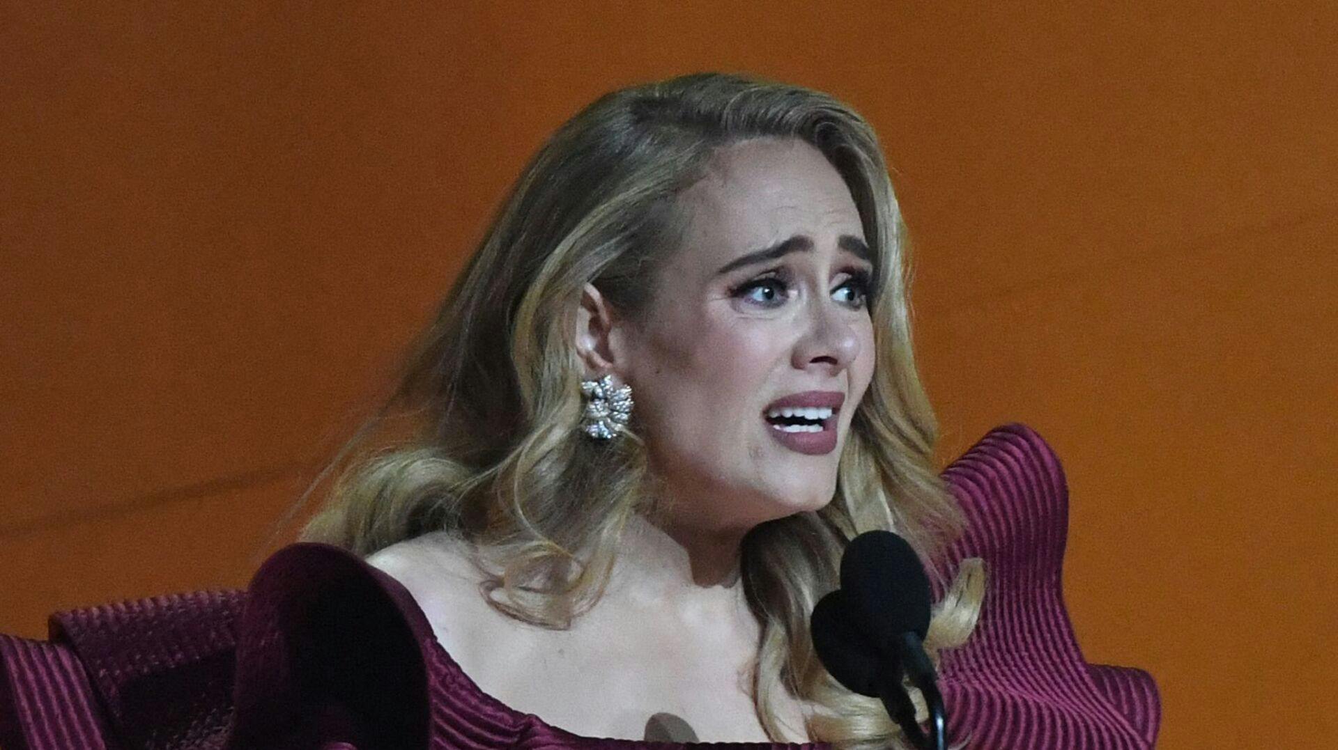 English singer-songwriter Adele accepts the award for Best Pop Solo Performance for "Easy on Me" during the 65th Annual Grammy Awards at the Crypto.com Arena in Los Angeles on February 5, 2023. (Photo by VALERIE MACON / AFP)