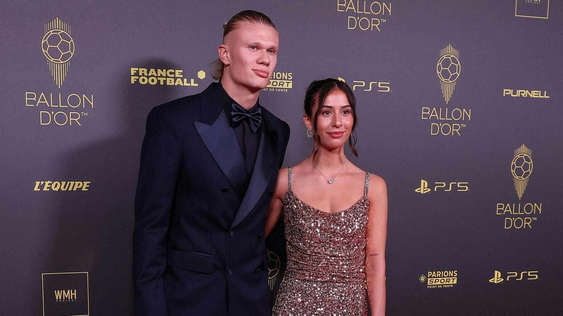 Manchester City's Norwegian forward Erling Haaland (L) and his wife Isabel Haugseng Johansen pose prior to the 2023 Ballon d'Or France Football award ceremony at the Theatre du Chatelet in Paris on October 30, 2023. (Photo by FRANCK FIFE / AFP)
