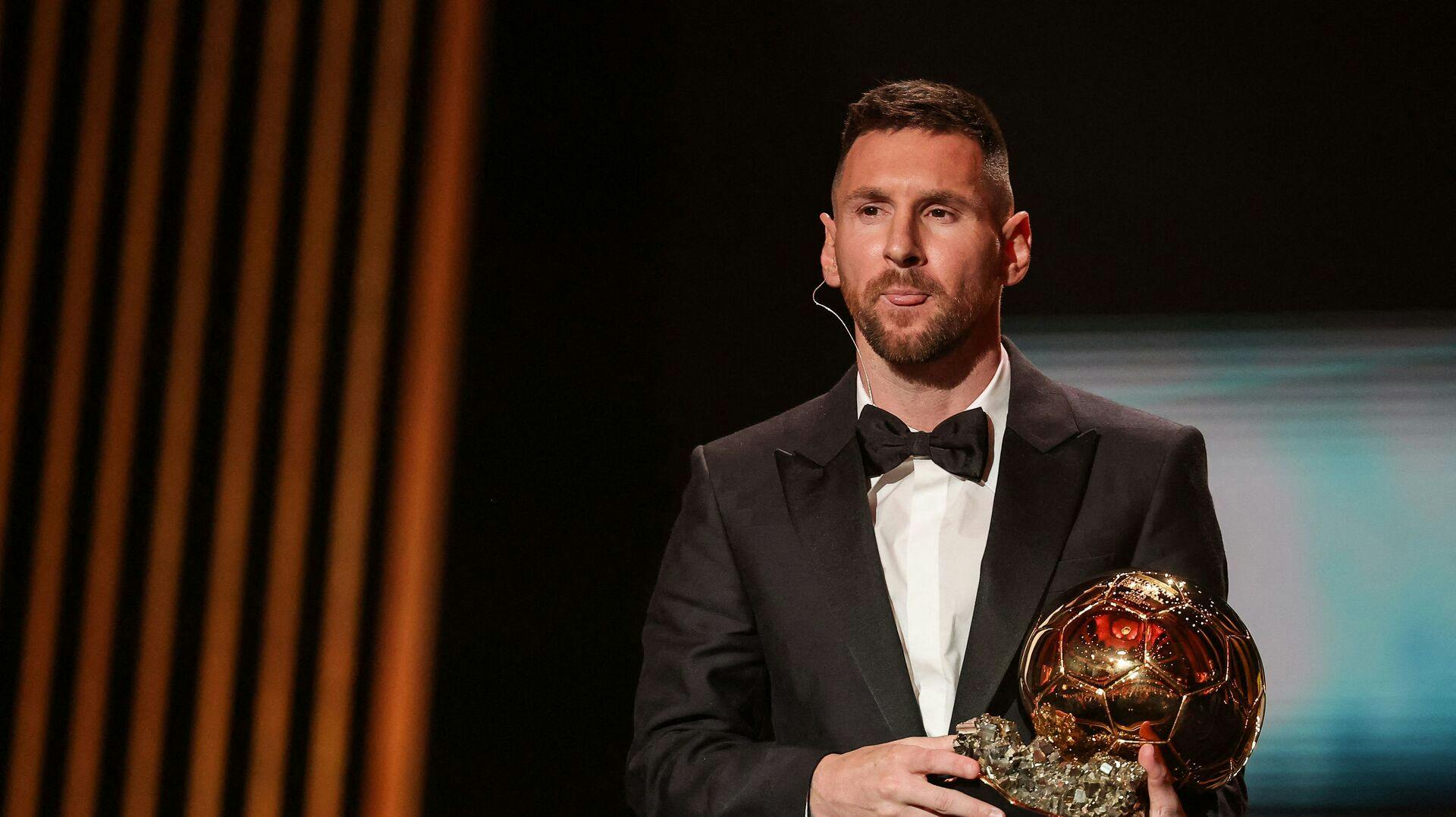 Inter Miami CF's Argentine forward Lionel Messi receives his 8th Ballon d'Or award during the 2023 Ballon d'Or France Football award ceremony at the Theatre du Chatelet in Paris on October 30, 2023. (Photo by FRANCK FIFE / AFP)