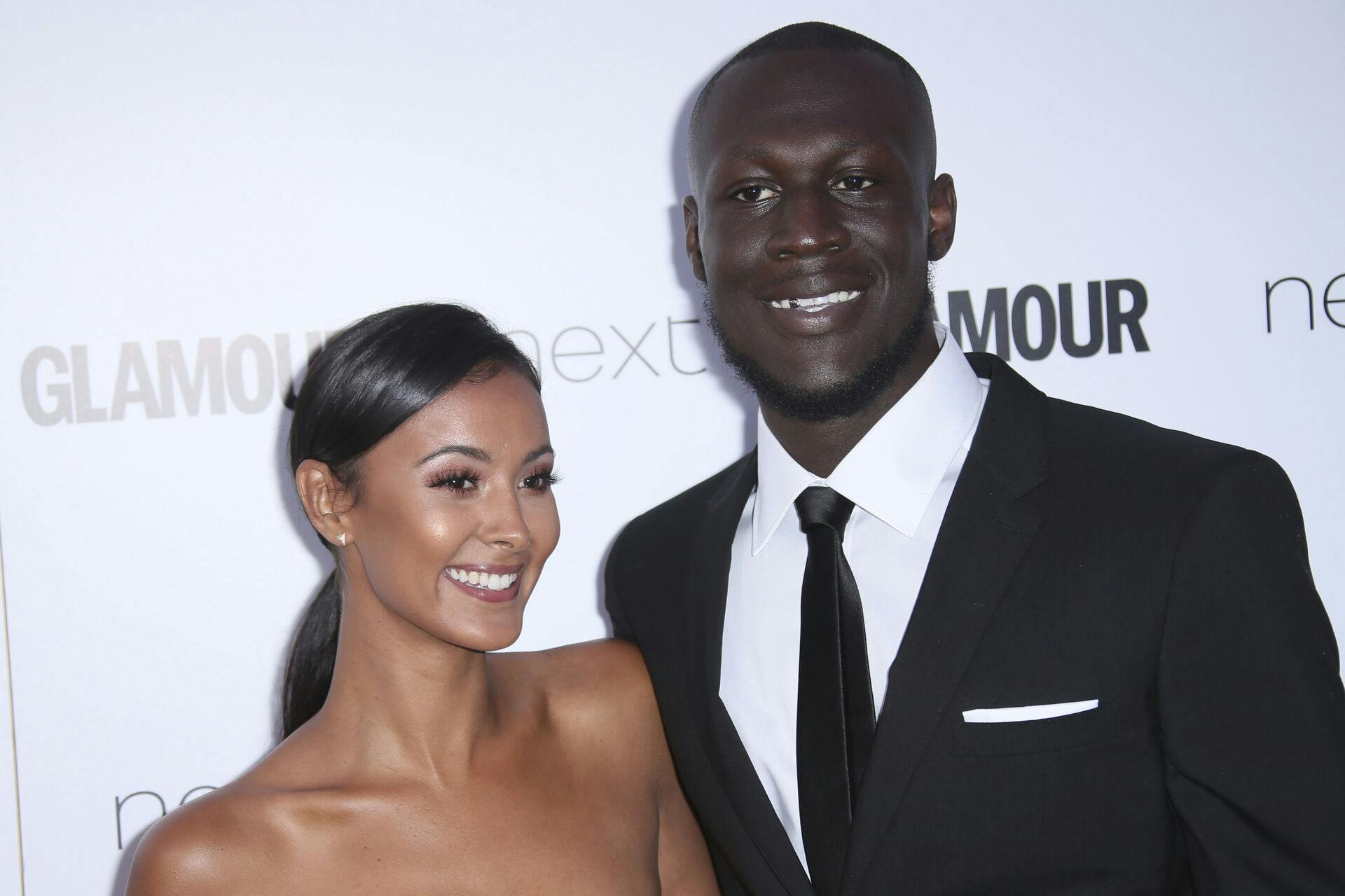 Stormzy and Maya Jama pose for photographers upon arrival at the Glamour Woman of the Year Awards in London, Tuesday, June 6, 2017. (Photo by Joel Ryan/Invision/AP)