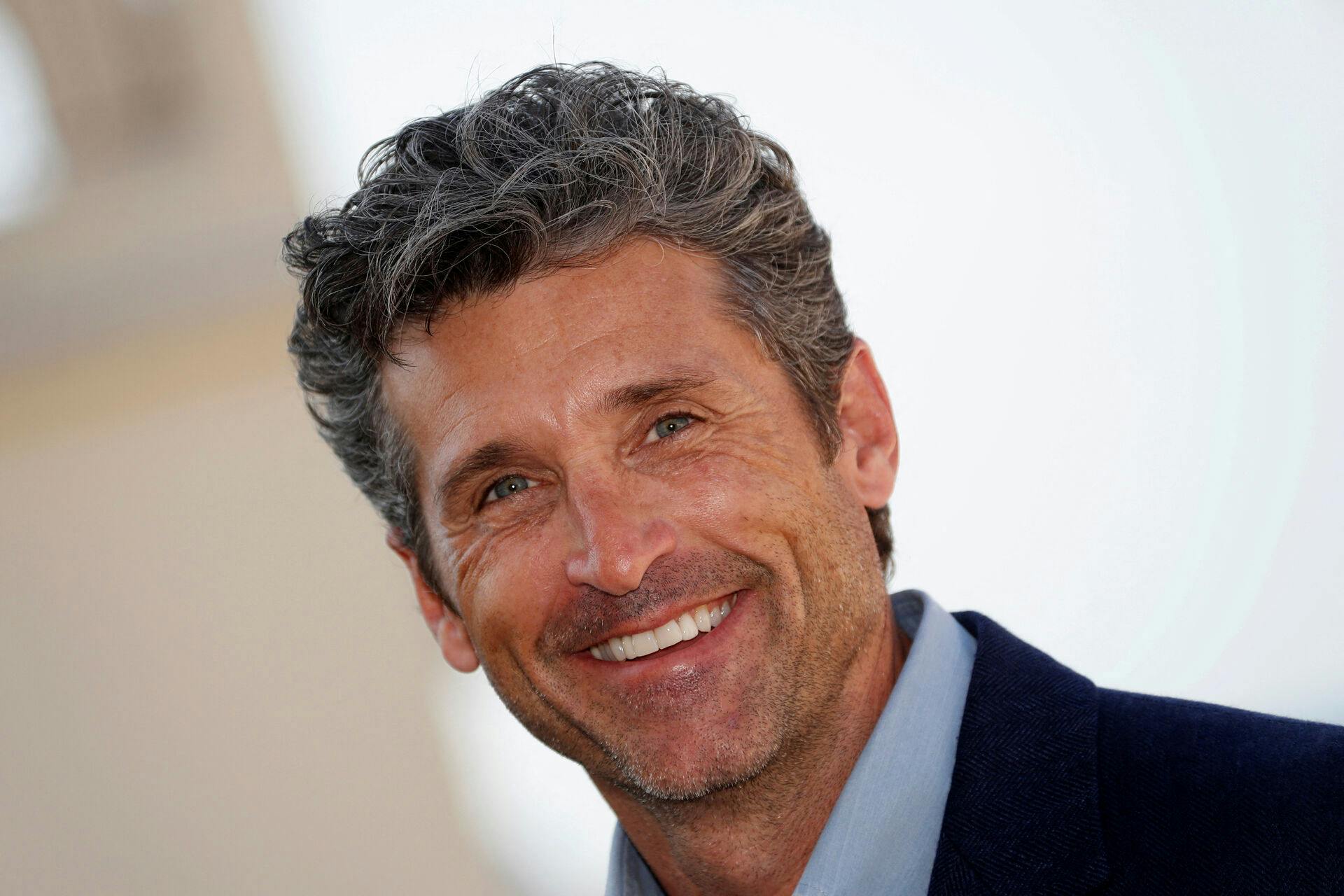 FILE PHOTO: FILE PHOTO: Actor Patrick Dempsey poses during a photocall for the television series "Devils" during the annual MIPCOM television programme market in Cannes, France, October 14, 2019. REUTERS/Eric Gaillard/File Photo