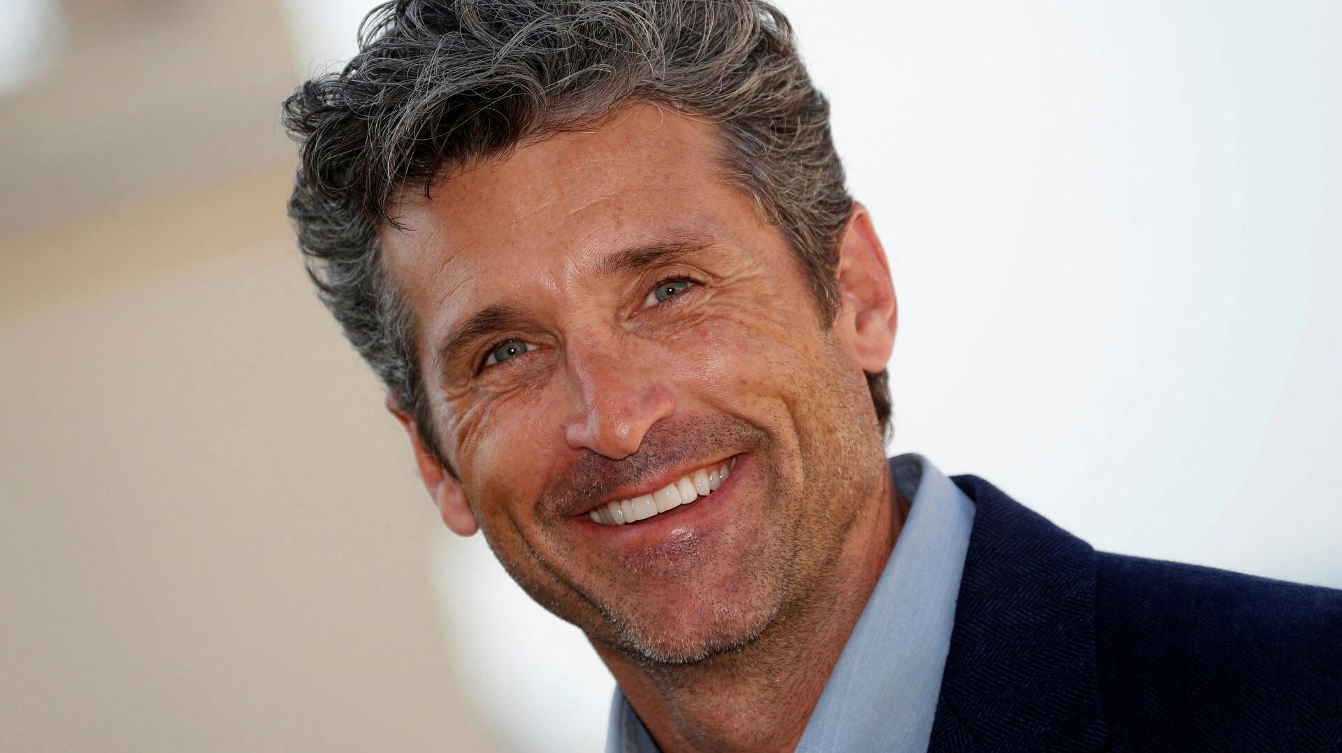 FILE PHOTO: FILE PHOTO: Actor Patrick Dempsey poses during a photocall for the television series "Devils" during the annual MIPCOM television programme market in Cannes, France, October 14, 2019. REUTERS/Eric Gaillard/File Photo