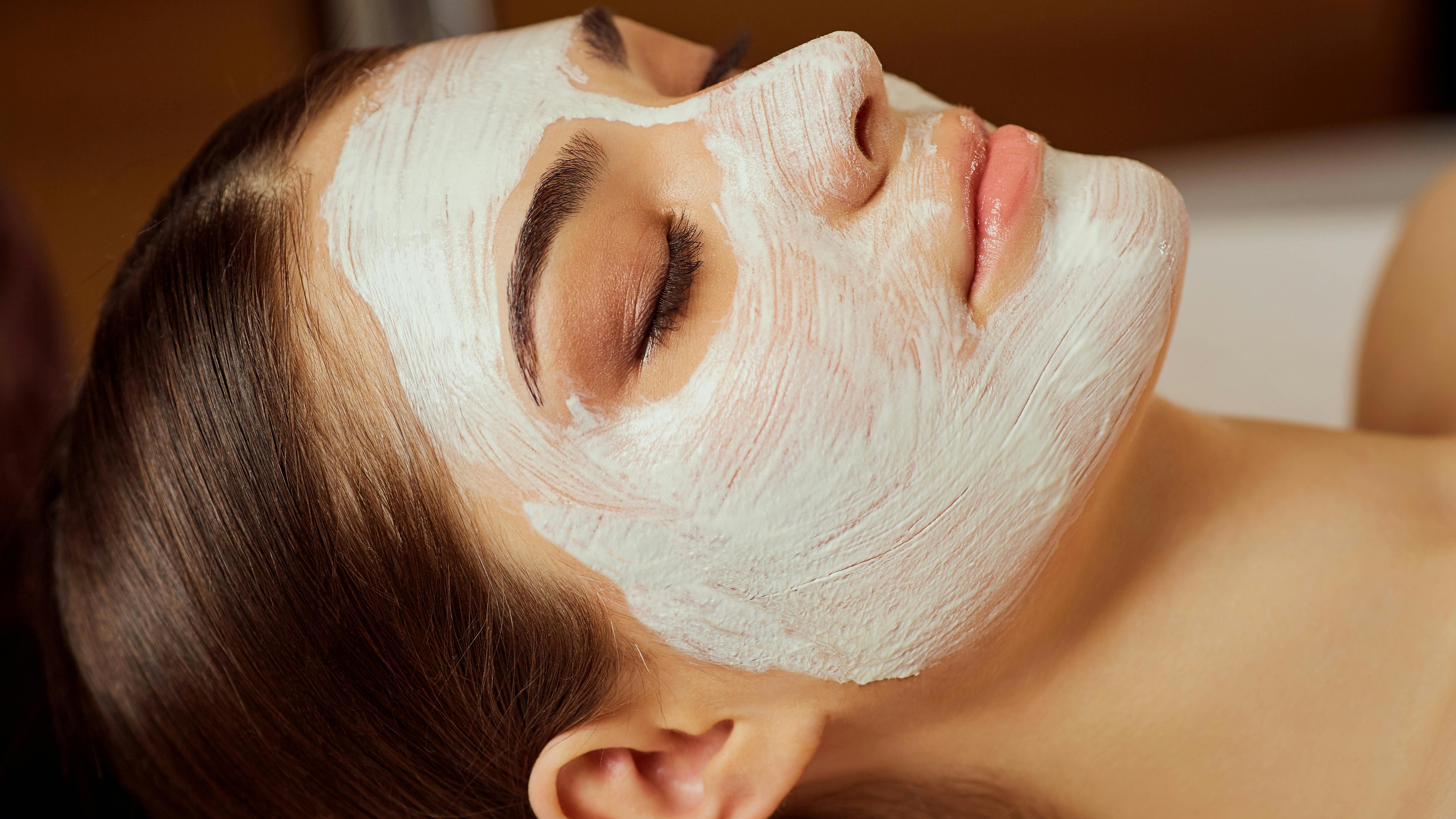 Close-up face of young woman with mask on face.