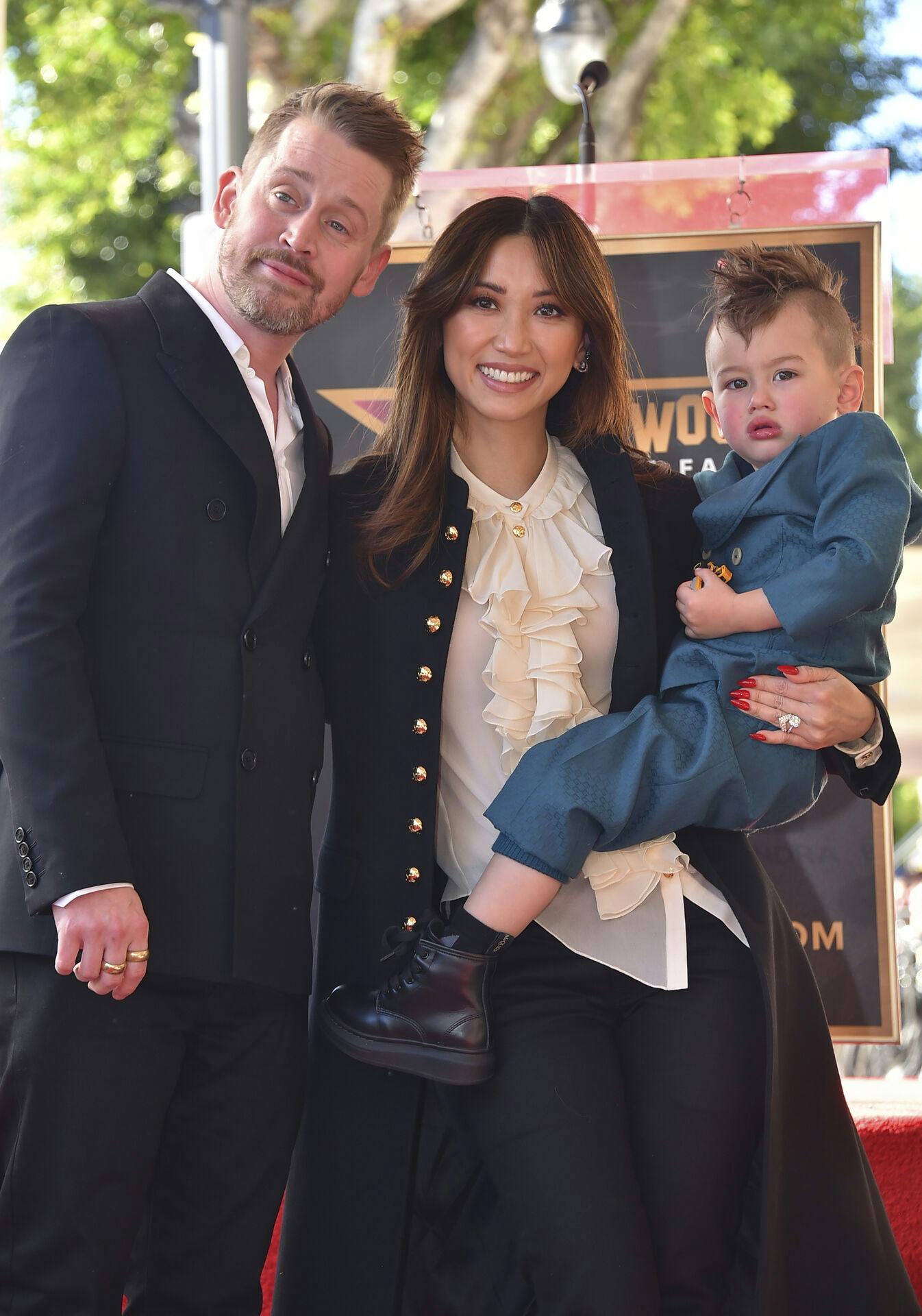 Macaulay Culkin, from left, Brenda Song, and son Dakota Song Culkin attend a ceremony honoring Macaulay Culkin with a star on the Hollywood Walk of Fame on Friday, Dec. 1, 2023, in Los Angeles. (Photo by Jordan Strauss/Invision/AP)