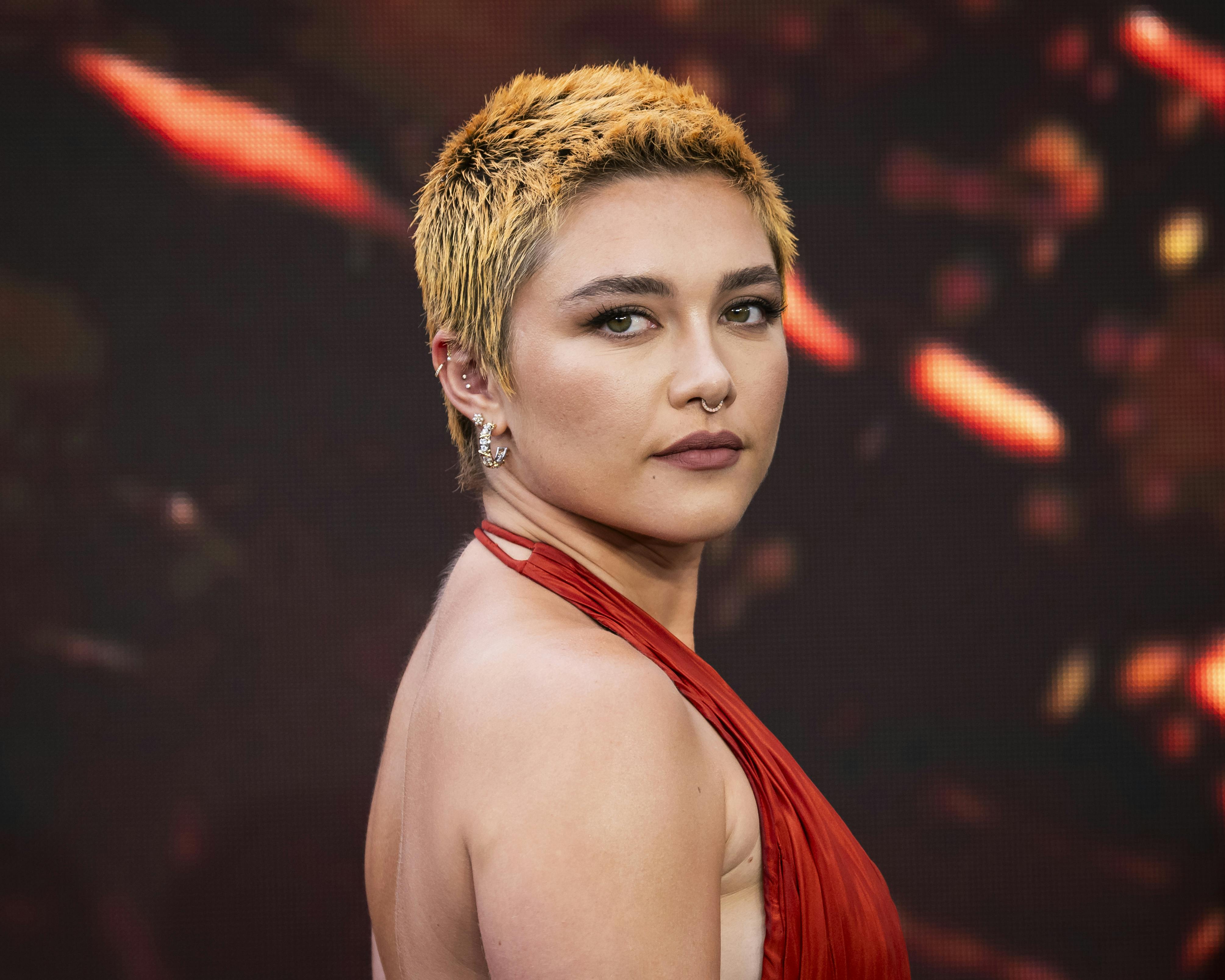 Florence Pugh poses for photographers upon arrival at the premiere of the film 'Oppenheimer' on Thursday, July 13, 2023 in London. (Scott Garfitt/Invision/AP)