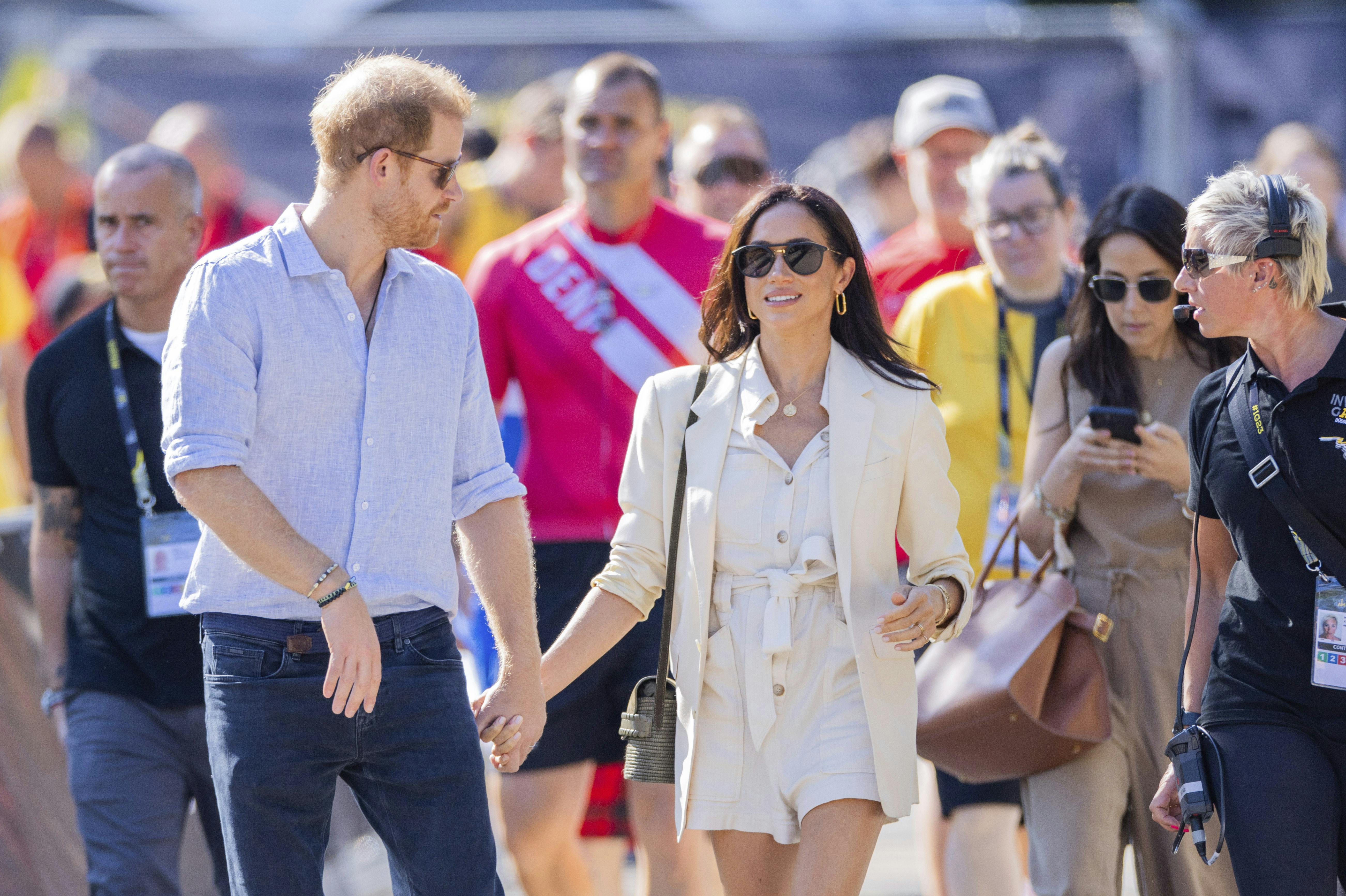15 September 2023, North Rhine-Westphalia, Duesseldorf: Prince Harry, Duke of Sussex, and his wife Meghan, Duchess of Sussex, arrive for the cycling medal ceremony at the 6th Invictus Games next to the Merkur Spiel Arena. Prince Harry celebrates his 39th birthday today. The Paralympic competition for war-disabled athletes is hosted in Germany for the first time. Photo by: Rolf Vennenbernd/picture-alliance/dpa/AP Images