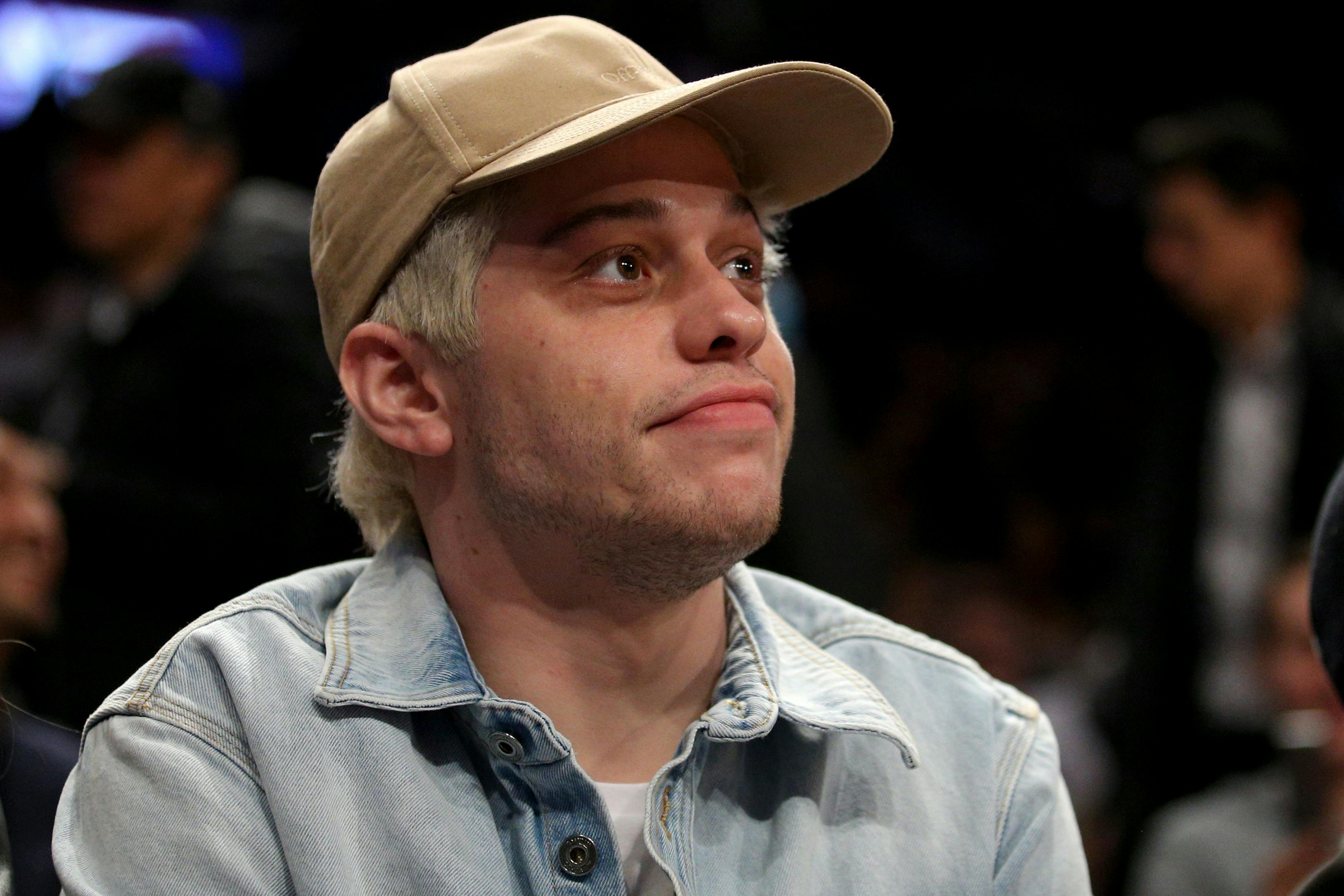 Nov 30, 2021; Brooklyn, New York, USA; American actor and comedian Pete Davidson sits courtside during the third quarter between the Brooklyn Nets and the New York Knicks at Barclays Center. Mandatory Credit: Brad Penner-USA TODAY Sports