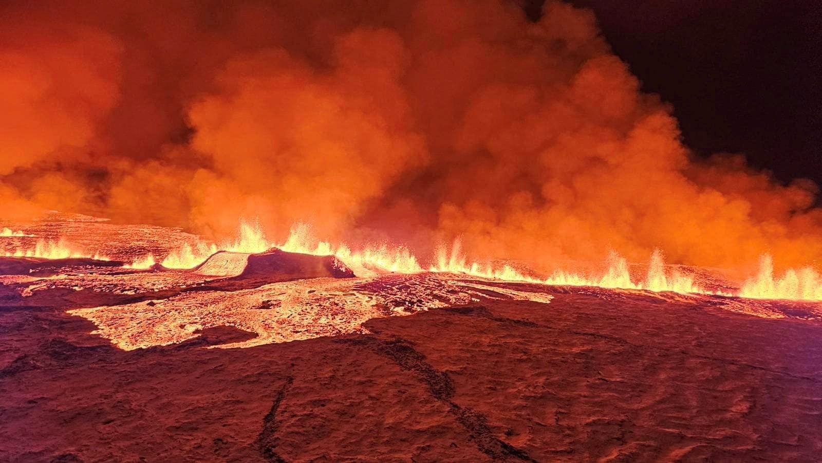 A volcano spews lava and smoke as it erupts in Grindavik, Iceland, December 18, 2023. Civil Protection of Iceland/Handout via REUTERS THIS IMAGE HAS BEEN SUPPLIED BY A THIRD PARTY.NO RESALES.NO ARCHIVES. MANDATORY CREDIT
